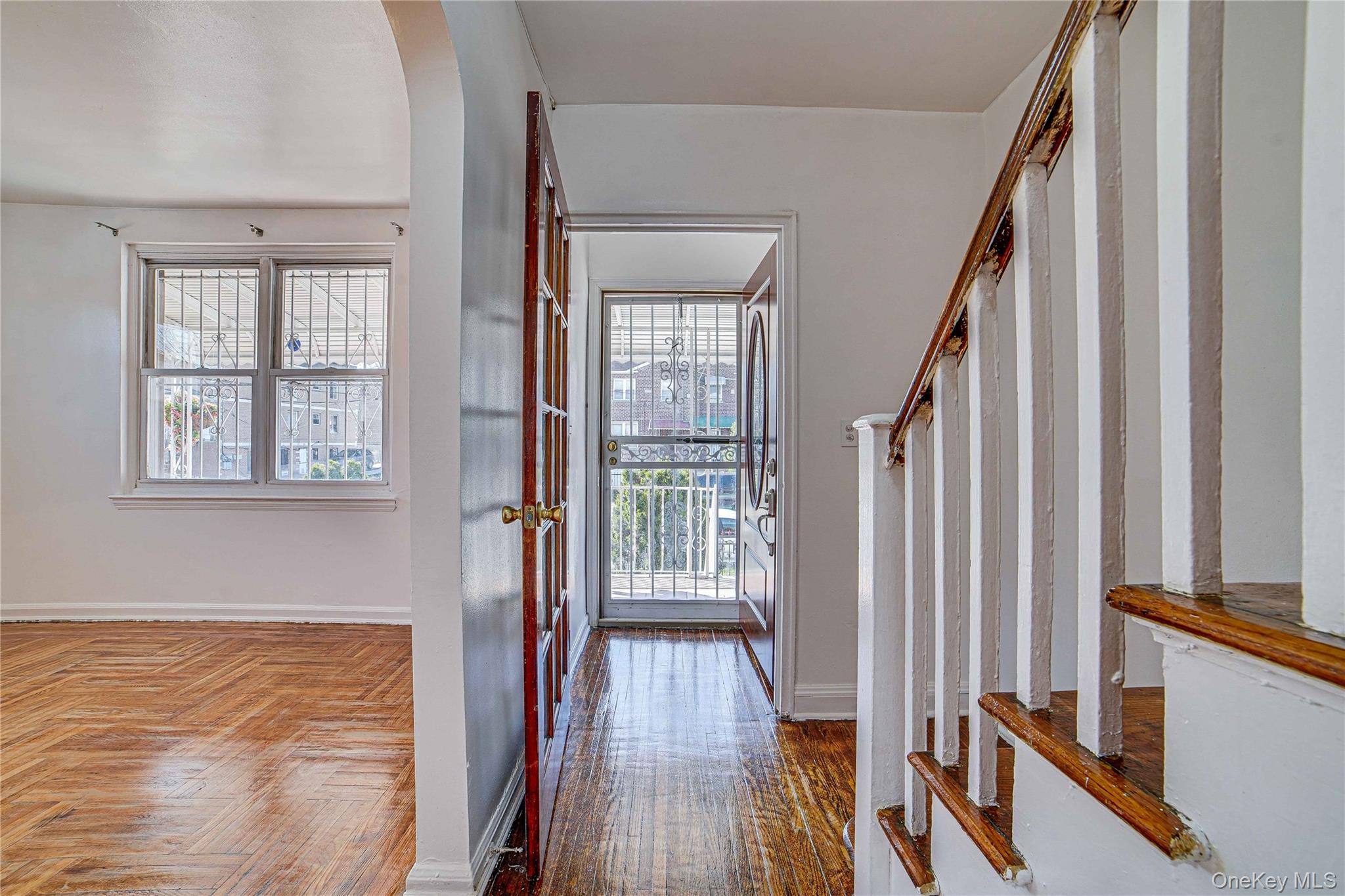 993 Duncan Street Bronx, NY 10469 - Photo 7 of 32 a view of a hallway with wooden floor and staircase