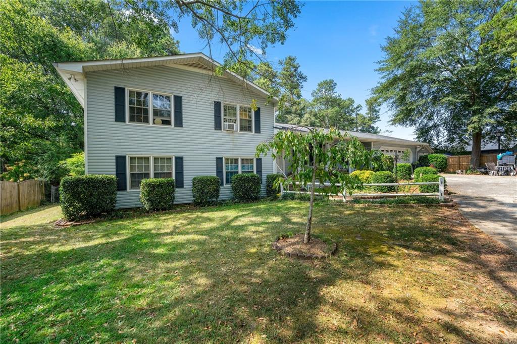 a view of a house with a yard