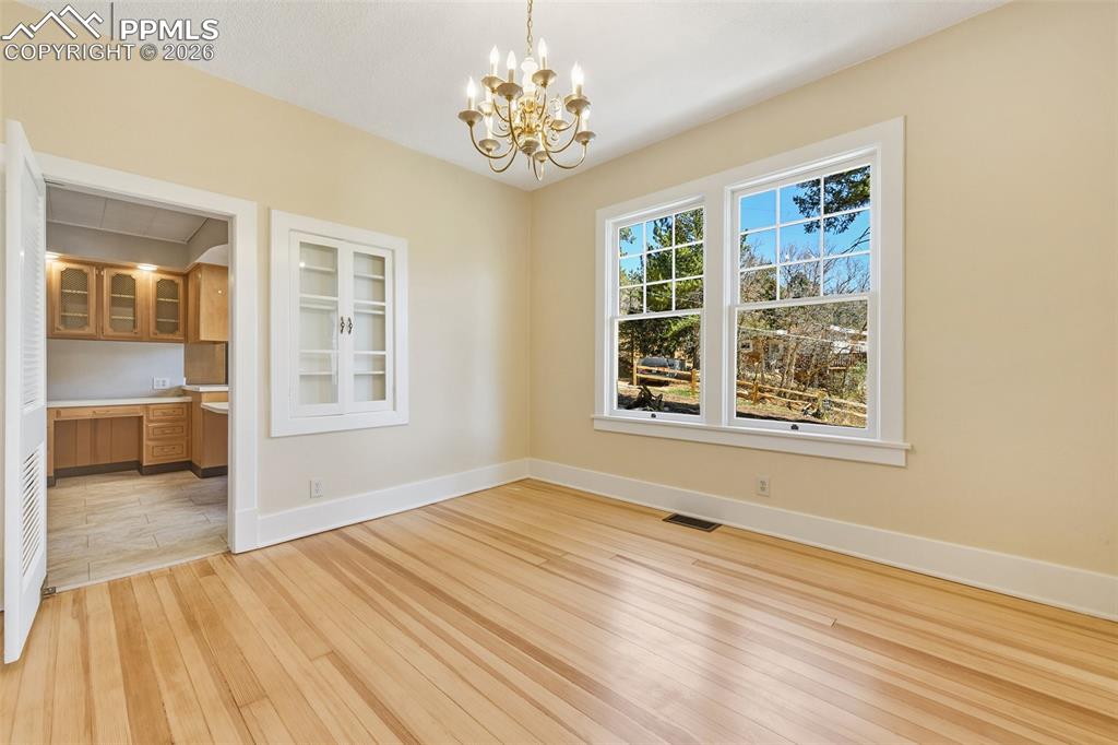 4530 Hagerman Road Cascade, CO 80809 - Photo 16 of 47 Formal Dining Room With View Into Kitchen