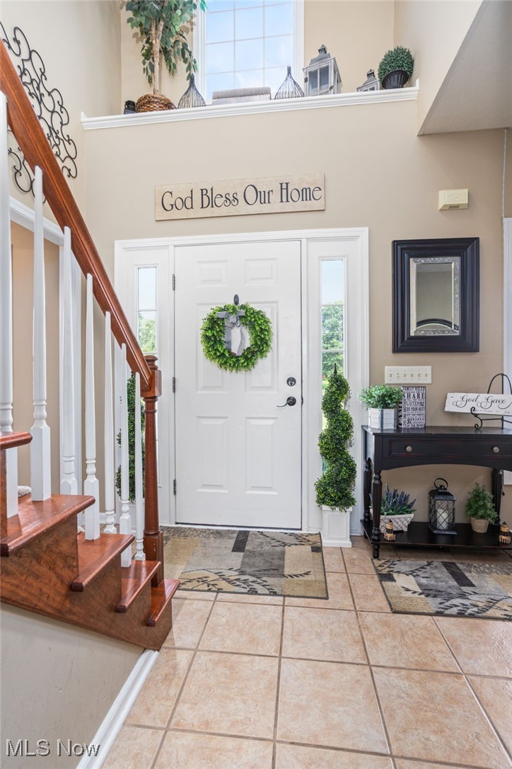 11620 Friendsville Road Creston, OH 44217 - Photo 7 of 40 Tiled foyer with a high ceiling and stairway