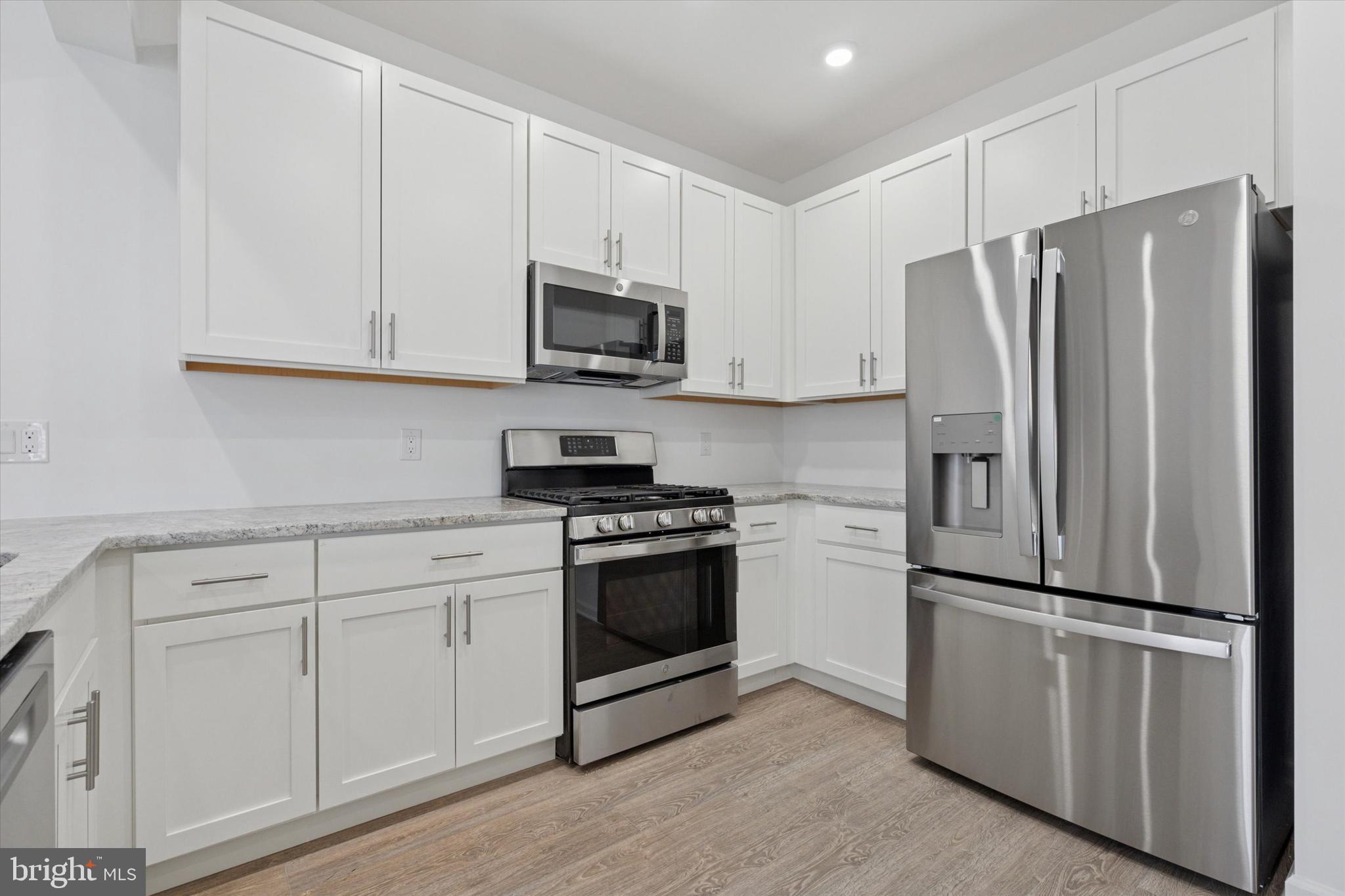 16241 River View Circle Bristol, PA 19007 - Photo 18 of 47 a kitchen with cabinets stainless steel appliances and a sink