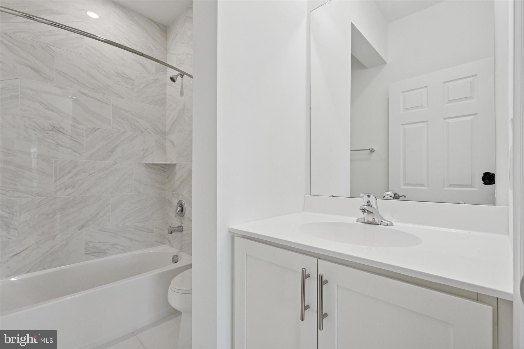 16241 River View Circle Bristol, PA 19007 - Photo 24 of 47 a bathroom with a sink a toilet and shower