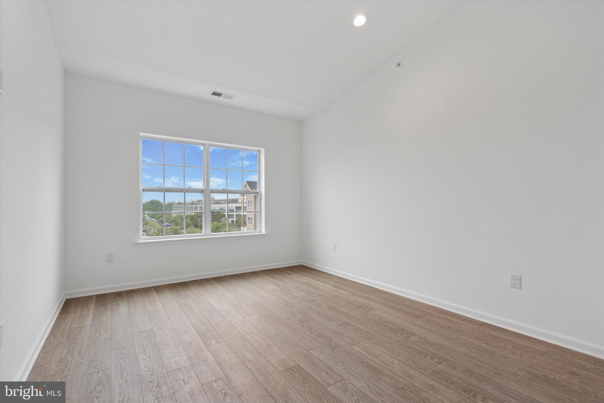 16241 River View Circle Bristol, PA 19007 - Photo 25 of 47 a view of an empty room with wooden floor and a window