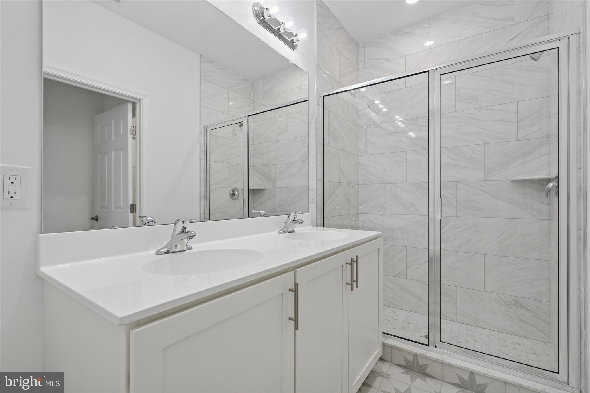 16241 River View Circle Bristol, PA 19007 - Photo 26 of 47 a bathroom with a sink shower and a mirror