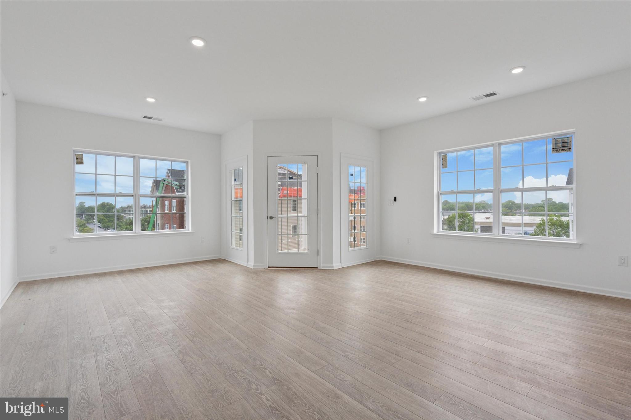 16241 River View Circle Bristol, PA 19007 - Photo 29 of 47 a view of an empty room with a window and wooden floor