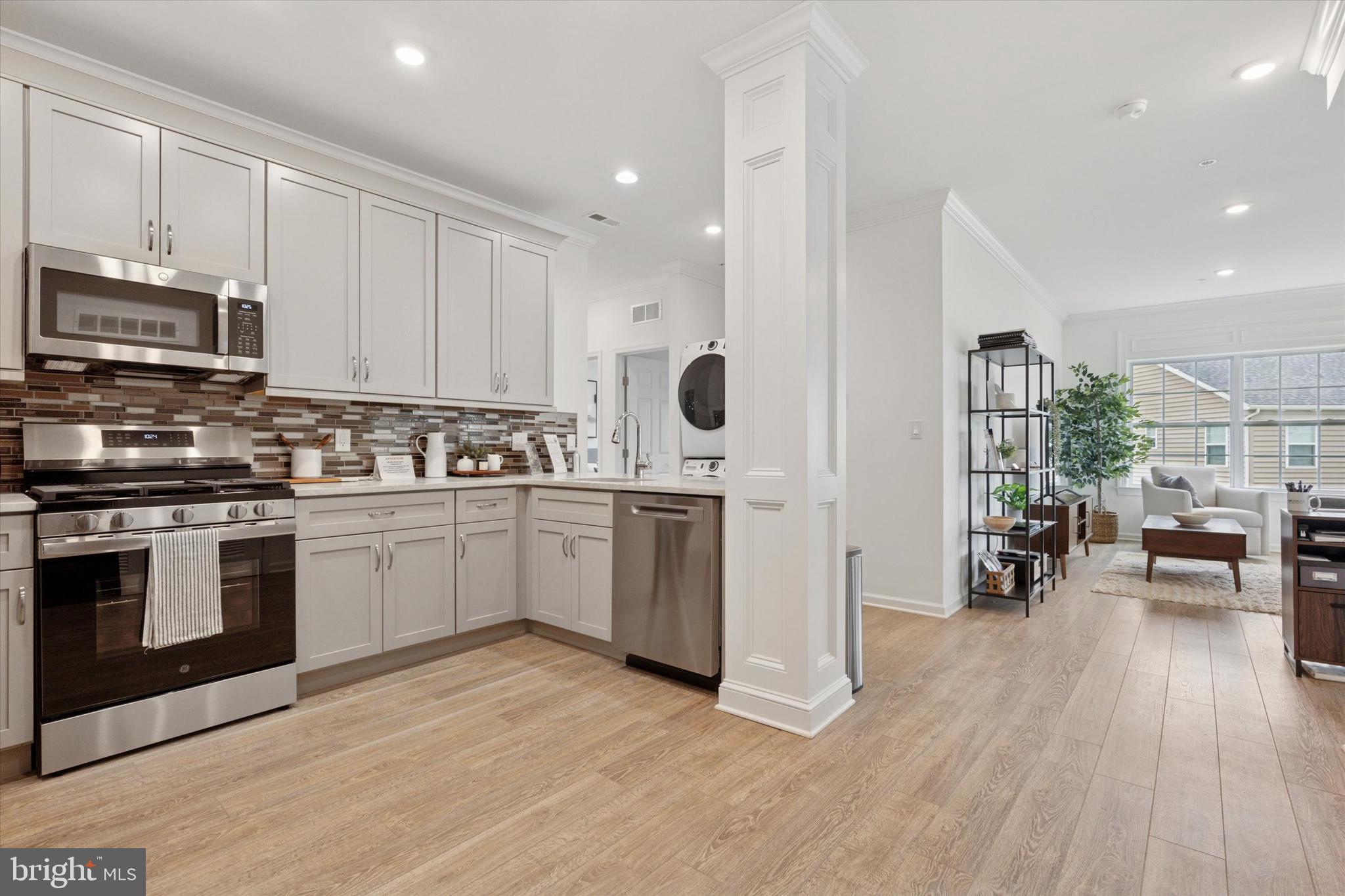 16241 River View Circle Bristol, PA 19007 - Photo 7 of 47 a kitchen with stove cabinets and wooden floor