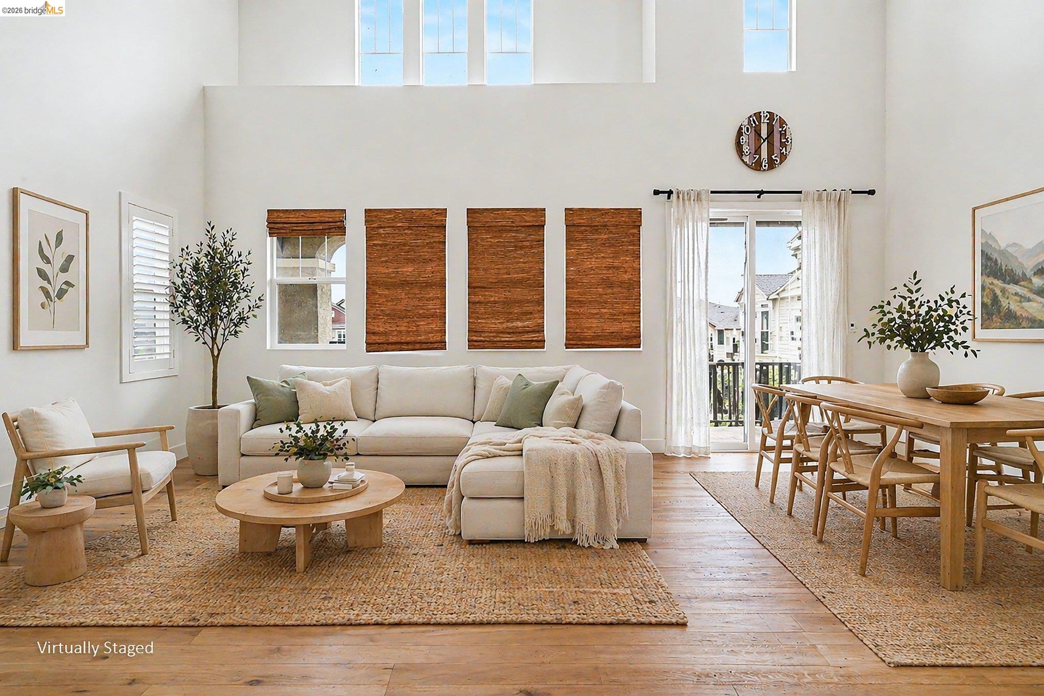 18210 Argento Loop San Ramon, CA 94583 - Photo 6 of 44 Spacious living area featuring high ceilings, wood-finish flooring, and natural light from transom windows