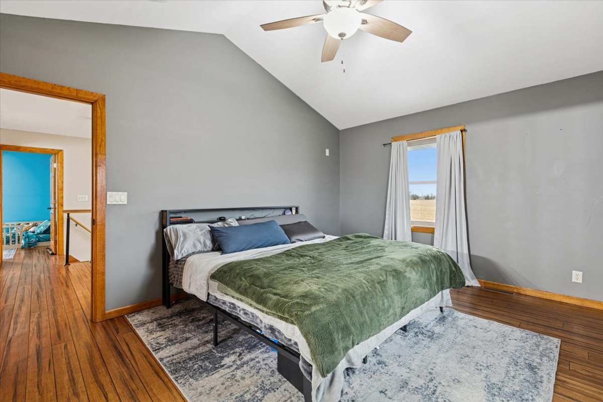 3326 Hayes Road Steward, IL 60553 - Photo 12 of 22 a bedroom with a bed and a chandelier