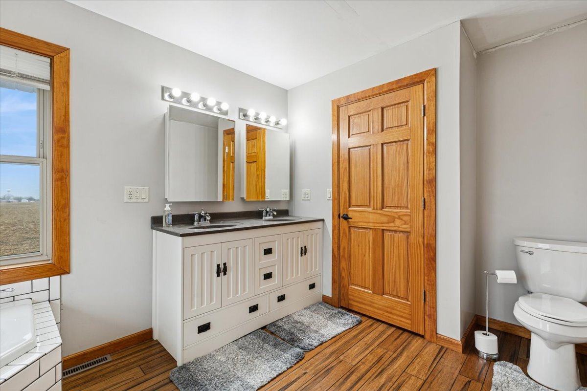 3326 Hayes Road Steward, IL 60553 - Photo 14 of 22 a bathroom with a granite countertop sink and a mirror
