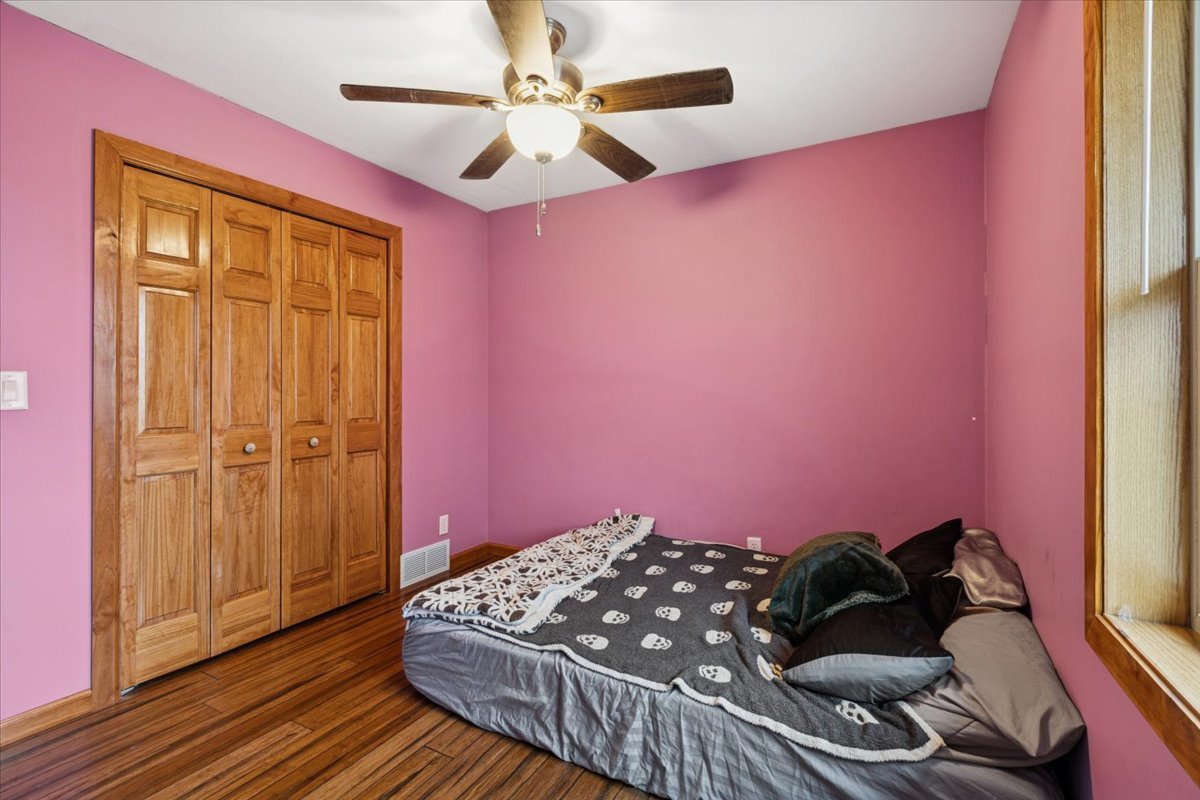 3326 Hayes Road Steward, IL 60553 - Photo 17 of 22 a bedroom with a bed and a chandelier