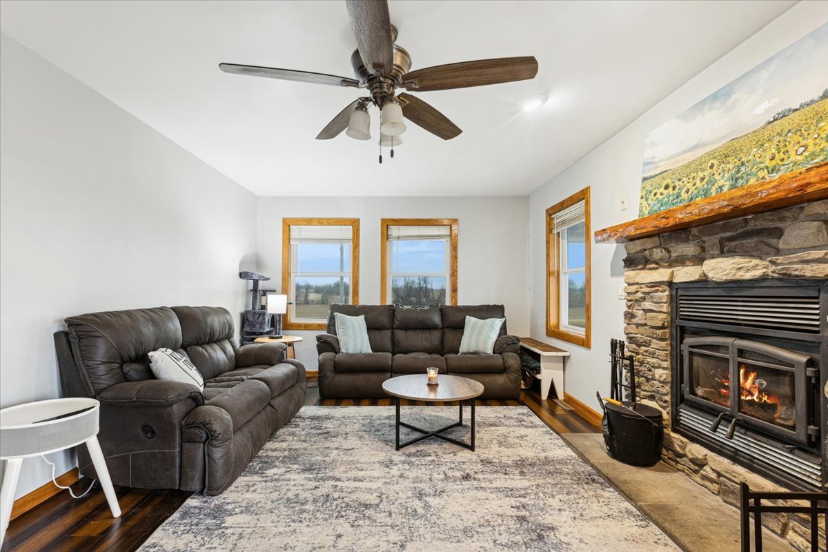 3326 Hayes Road Steward, IL 60553 - Photo 4 of 22 a living room with furniture a window and a fireplace