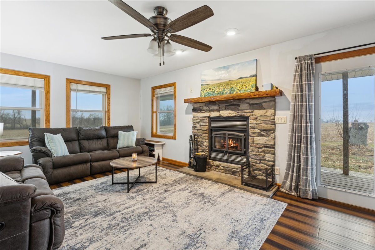 3326 Hayes Road Steward, IL 60553 - Photo 5 of 22 a living room with furniture a flat screen tv and a fireplace