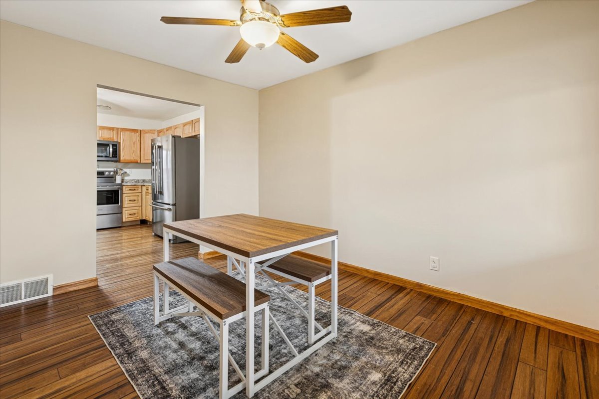 3326 Hayes Road Steward, IL 60553 - Photo 8 of 22 an empty room with wooden floor fan and windows