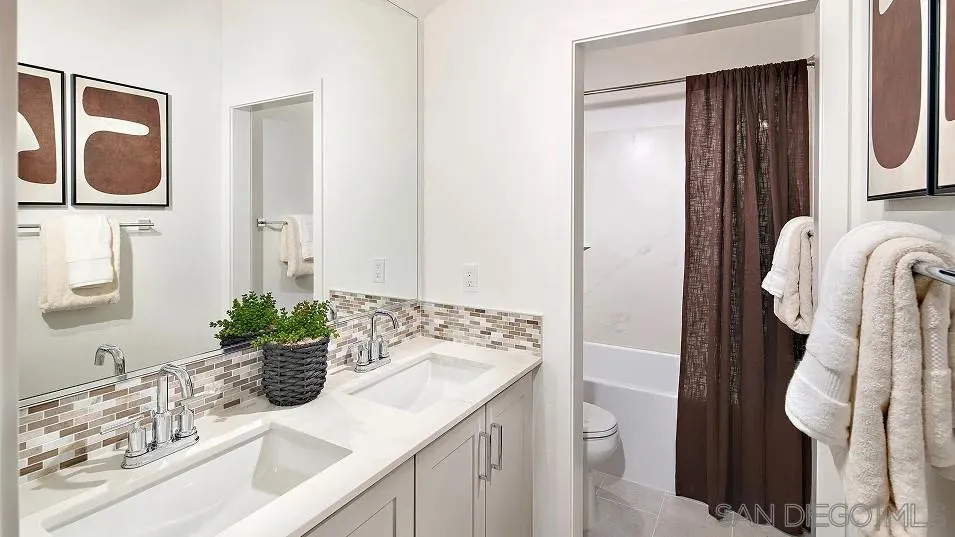 483 Gadget Road San Marcos, CA 92078 - Photo 12 of 20 a bathroom with a sink a toilet and mirror