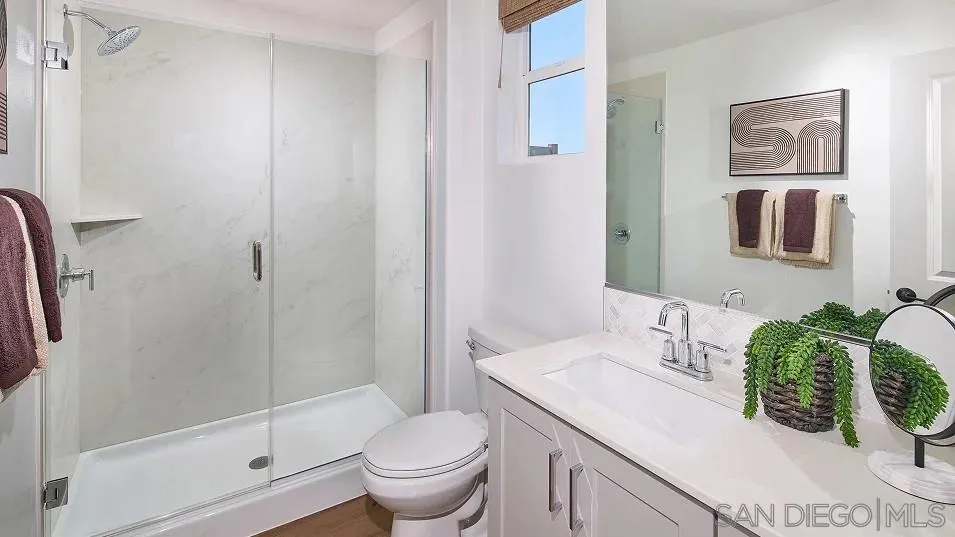 483 Gadget Road San Marcos, CA 92078 - Photo 15 of 20 a bathroom with a sink toilet and shower
