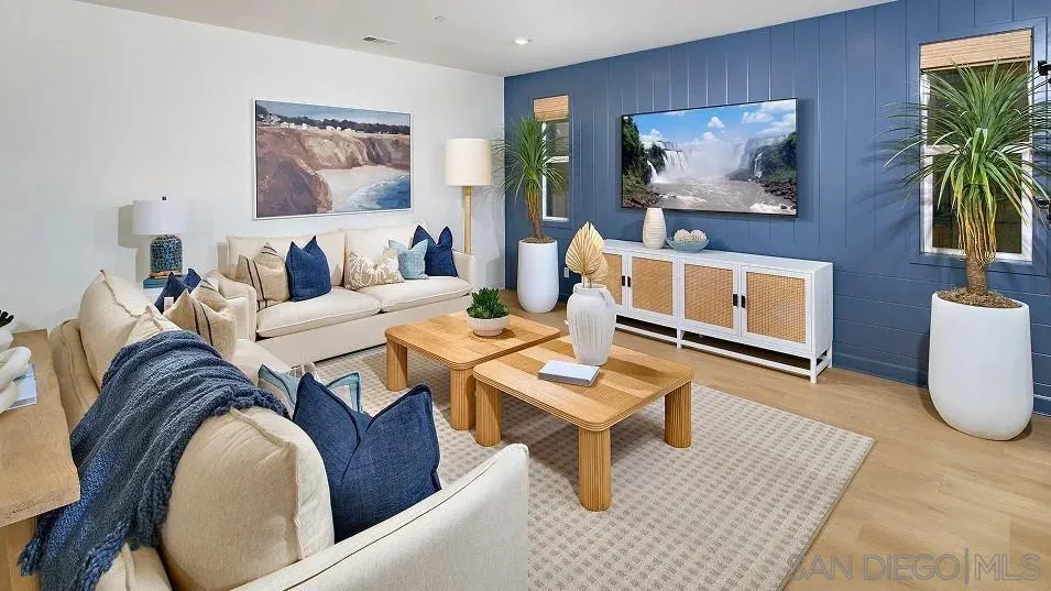 483 Gadget Road San Marcos, CA 92078 - Photo 8 of 20 a living room with furniture and a painting on the wall