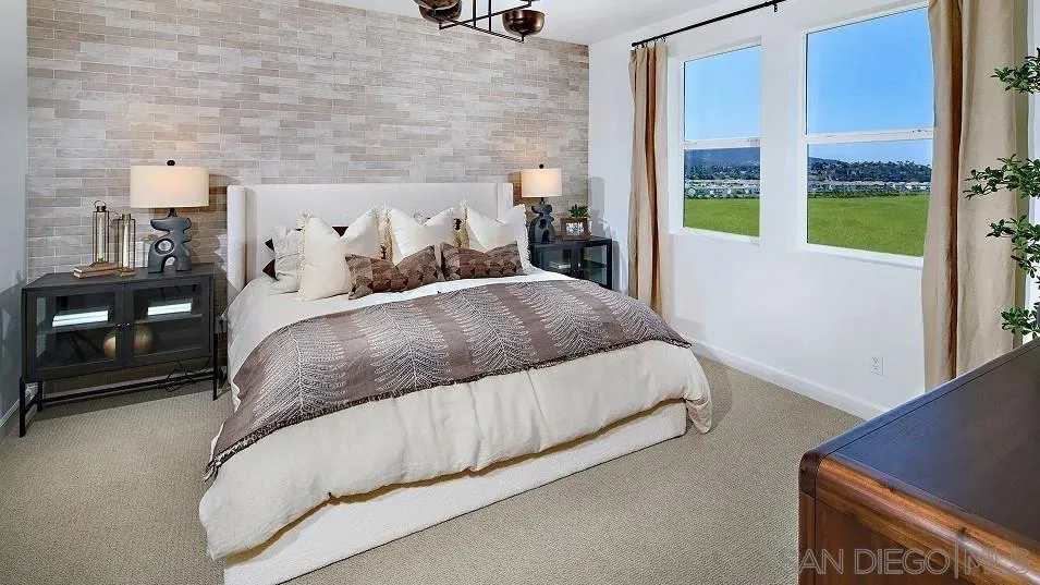 483 Gadget Road San Marcos, CA 92078 - Photo 9 of 20 a bedroom with a bed and a night stand