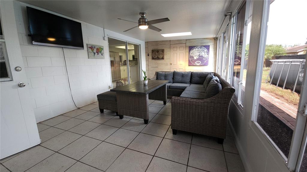 305 Gardenia Road Kissimmee, FL 34743 - Photo 17 of 28 a living room with furniture and a flat screen tv