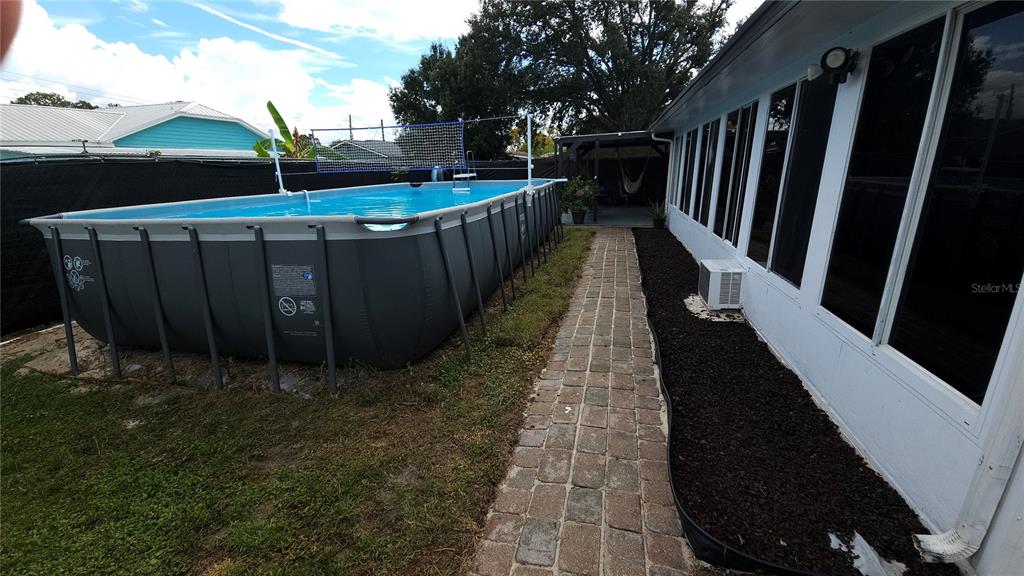 305 Gardenia Road Kissimmee, FL 34743 - Photo 19 of 28 a view of balcony with wooden floor