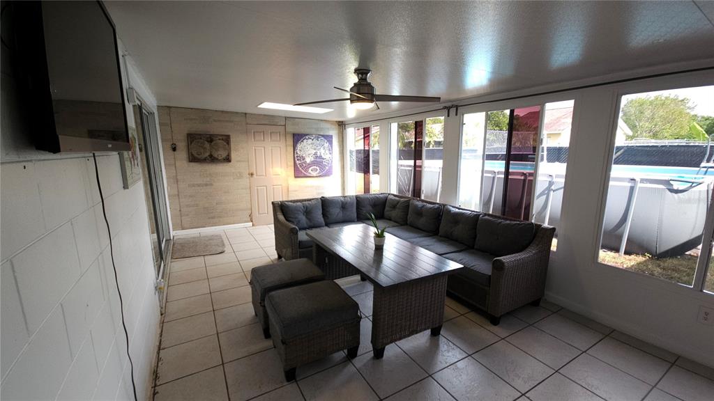 305 Gardenia Road Kissimmee, FL 34743 - Photo 21 of 28 a view of a dining room with furniture a livingroom and chandelier