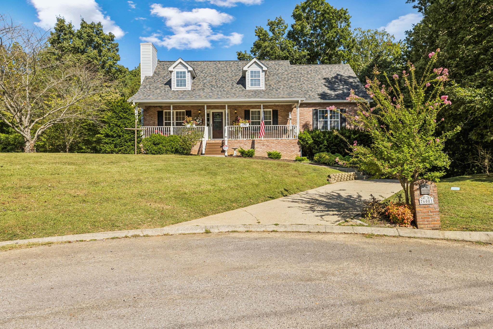 front view of a house next to a yard