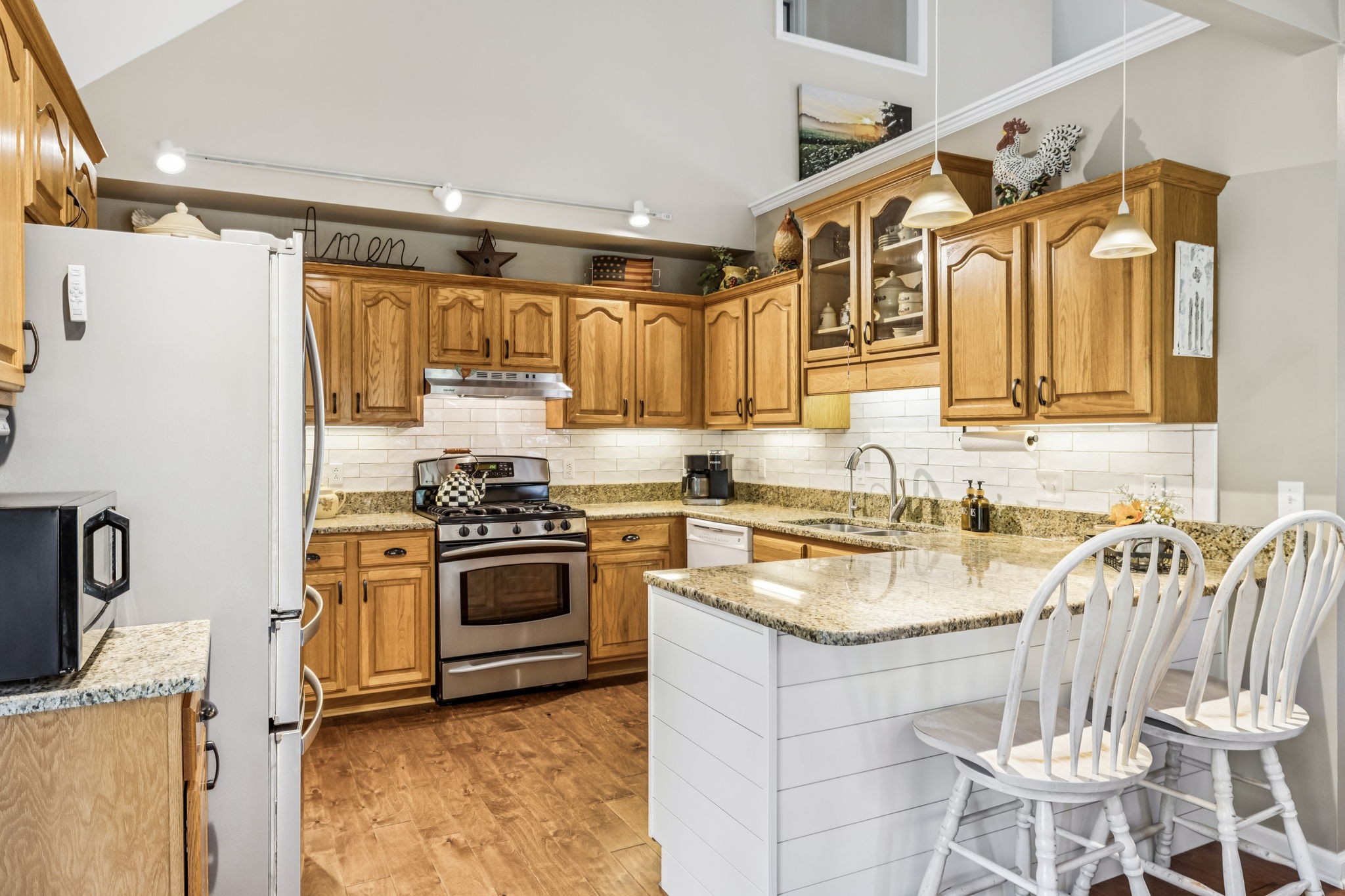 7608 Aubrey Ridge Court Fairview, TN 37062 - Photo 12 of 32 a kitchen with a stove a sink and a refrigerator