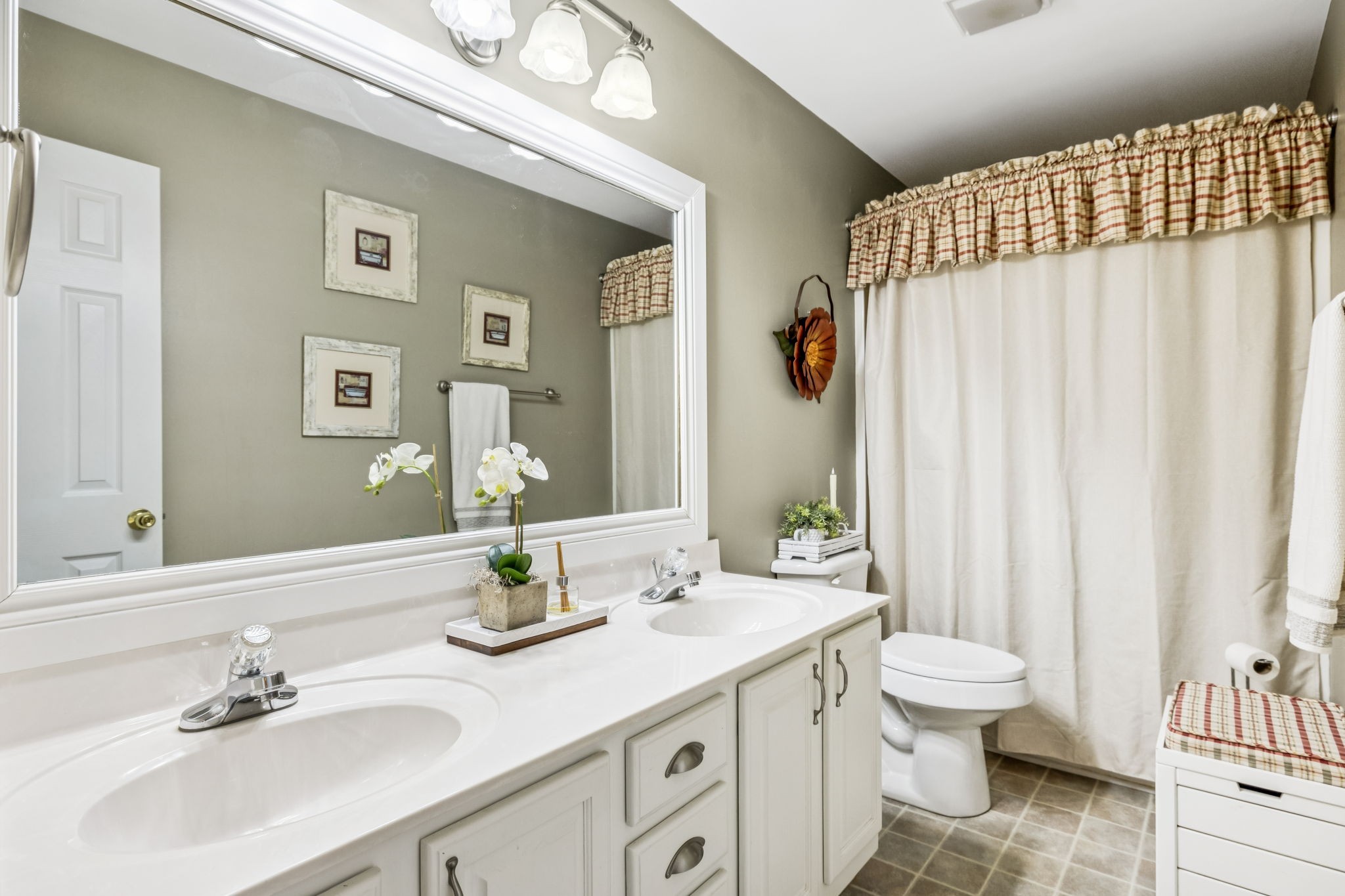 7608 Aubrey Ridge Court Fairview, TN 37062 - Photo 14 of 32 a bathroom with a sink a toilet and shower curtain