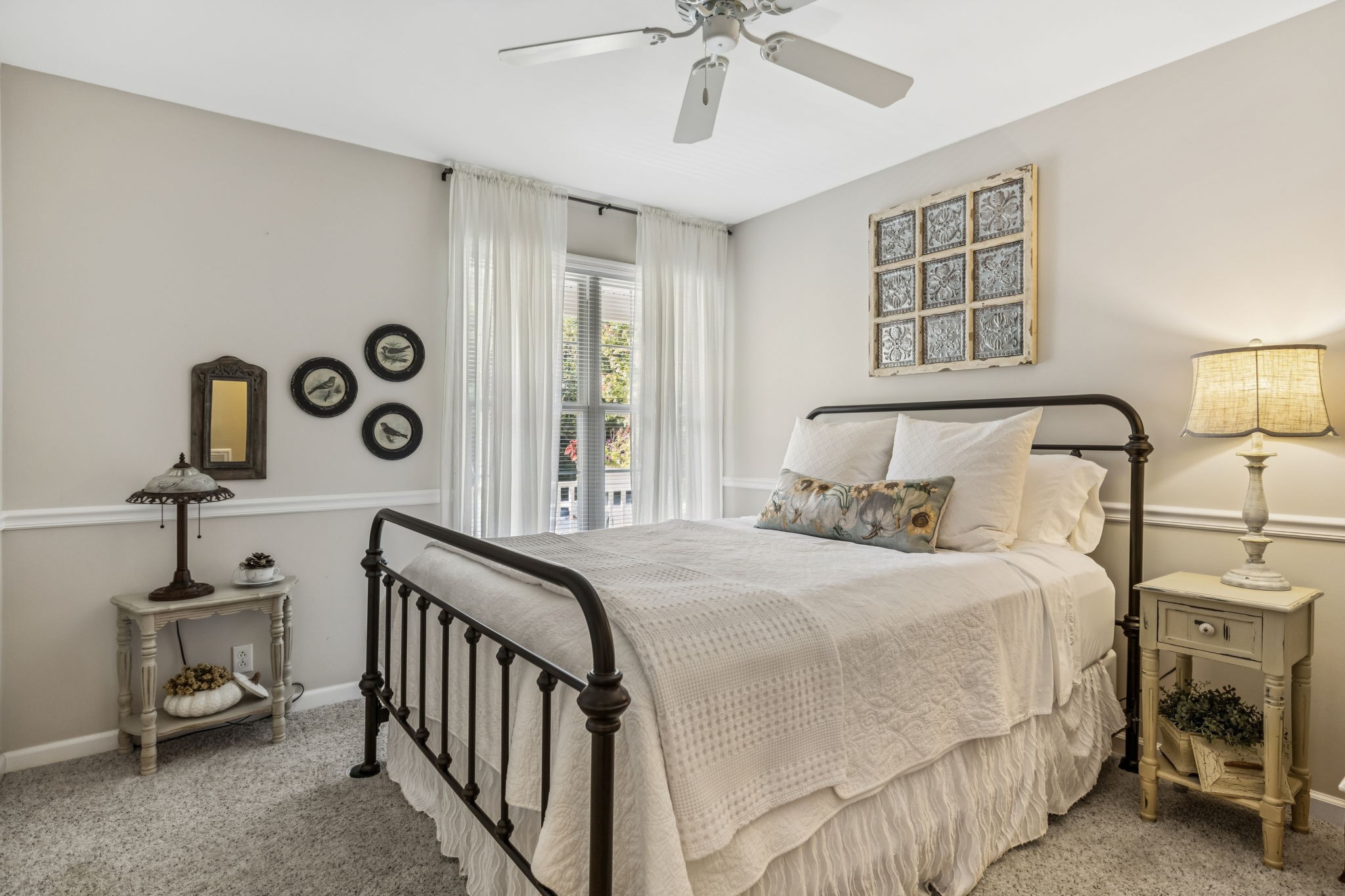 7608 Aubrey Ridge Court Fairview, TN 37062 - Photo 15 of 32 a bedroom with a large bed and a chandelier