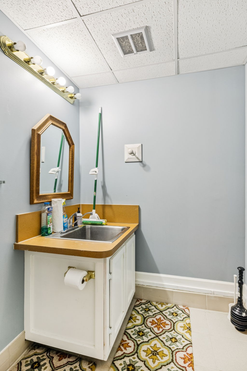 7608 Aubrey Ridge Court Fairview, TN 37062 - Photo 29 of 32 a bathroom with a sink and a mirror