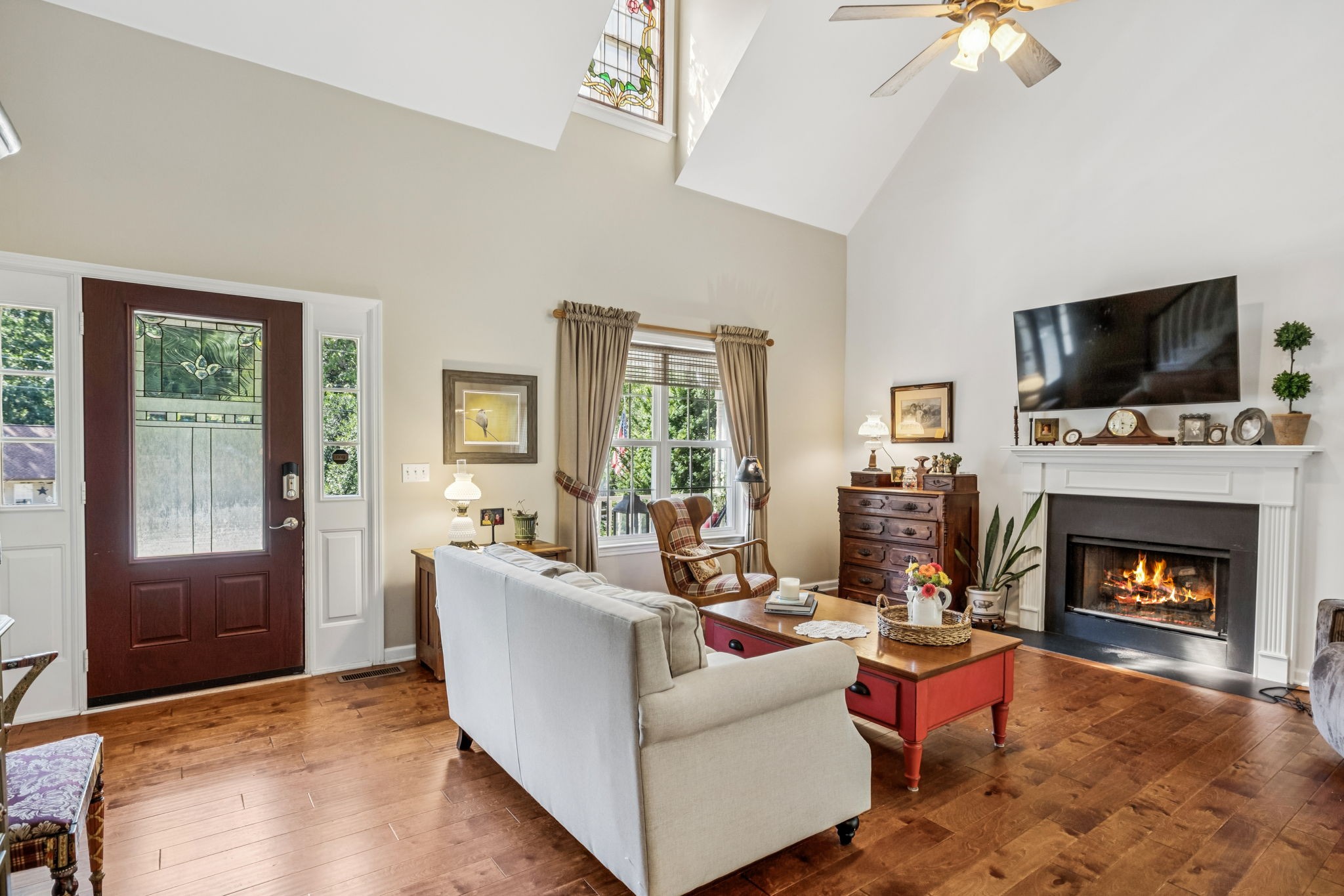 7608 Aubrey Ridge Court Fairview, TN 37062 - Photo 6 of 32 a living room with furniture a fireplace and a flat screen tv