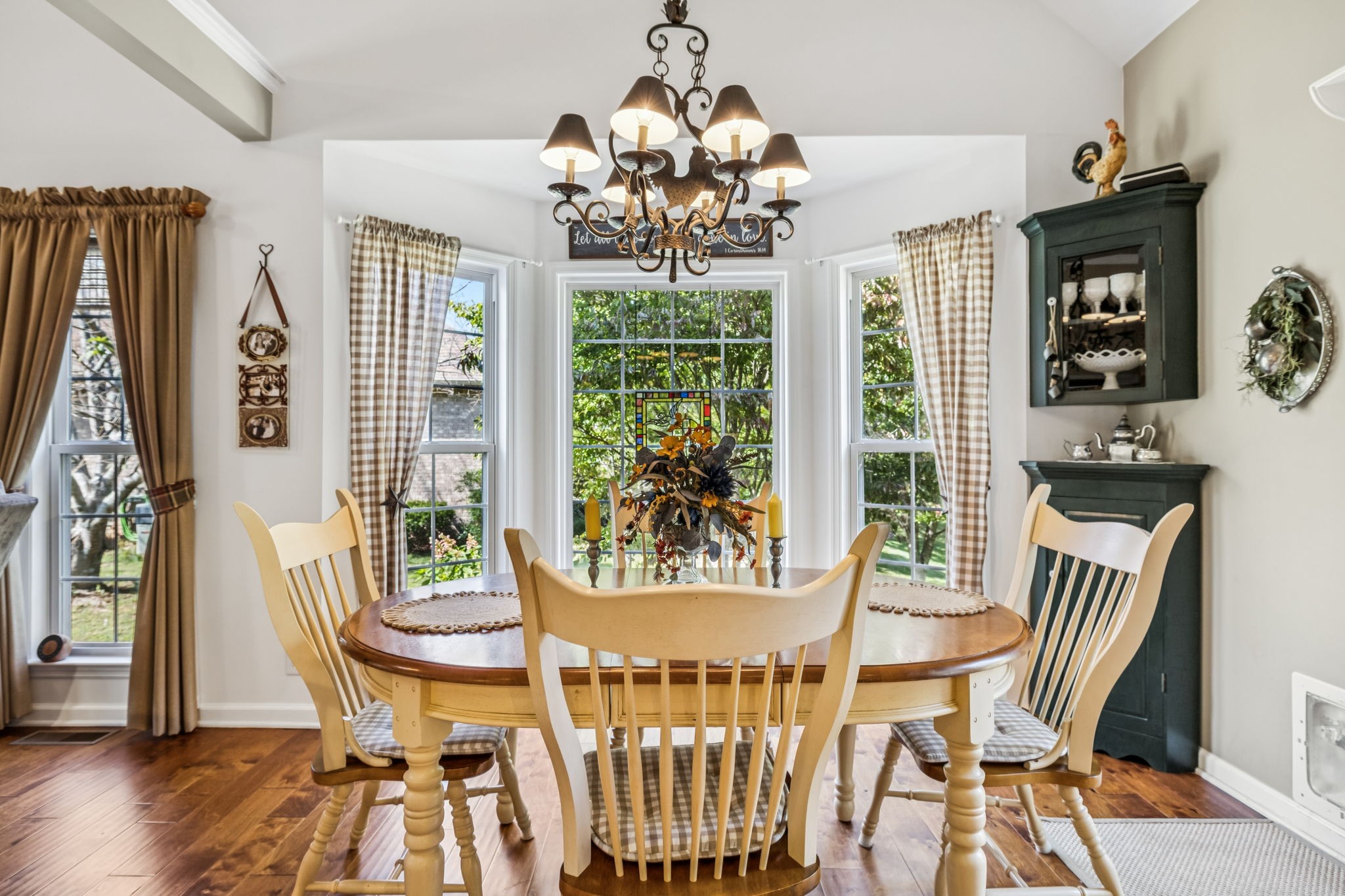 7608 Aubrey Ridge Court Fairview, TN 37062 - Photo 8 of 32 a view of a dining room with furniture wooden floor and chandelier