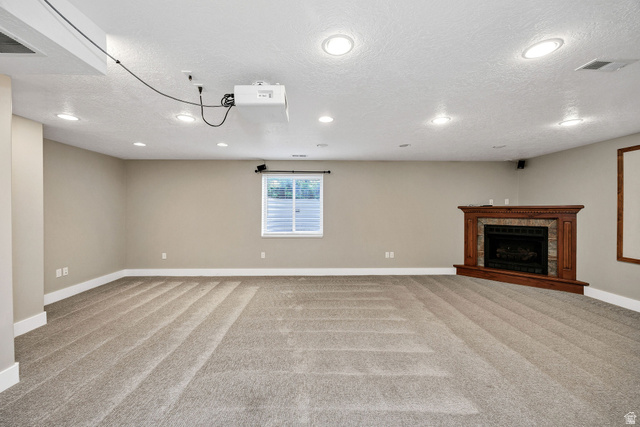 2912 South 1080th Street West Logan, UT 84321 - Photo 17 of 43 Spacious room featuring neutral paint, recessed lighting, and soft carpet flooring