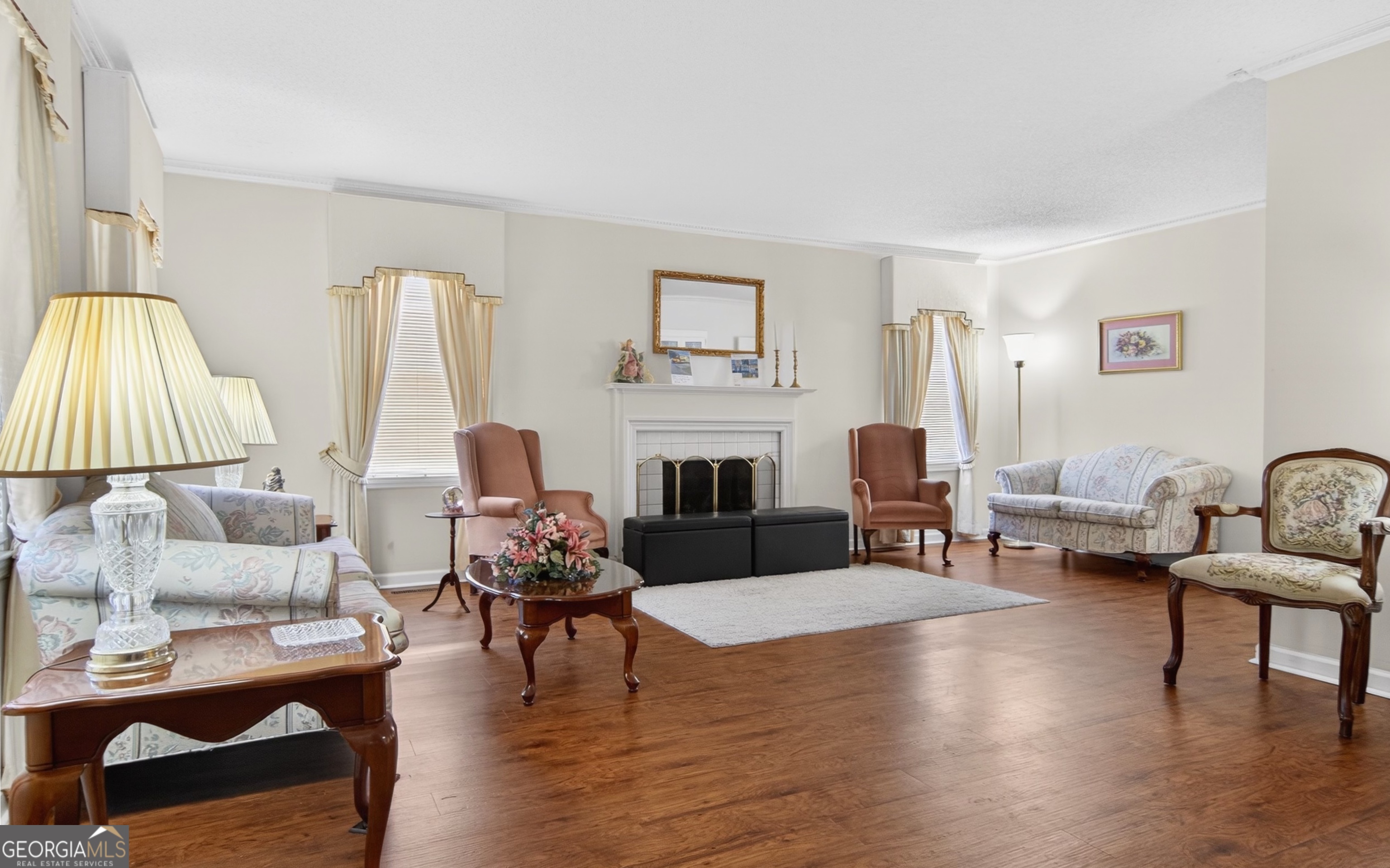 127 West Stuart Avenue Lyons, GA 30436 - Photo 11 of 71 a living room with furniture fireplace and a table