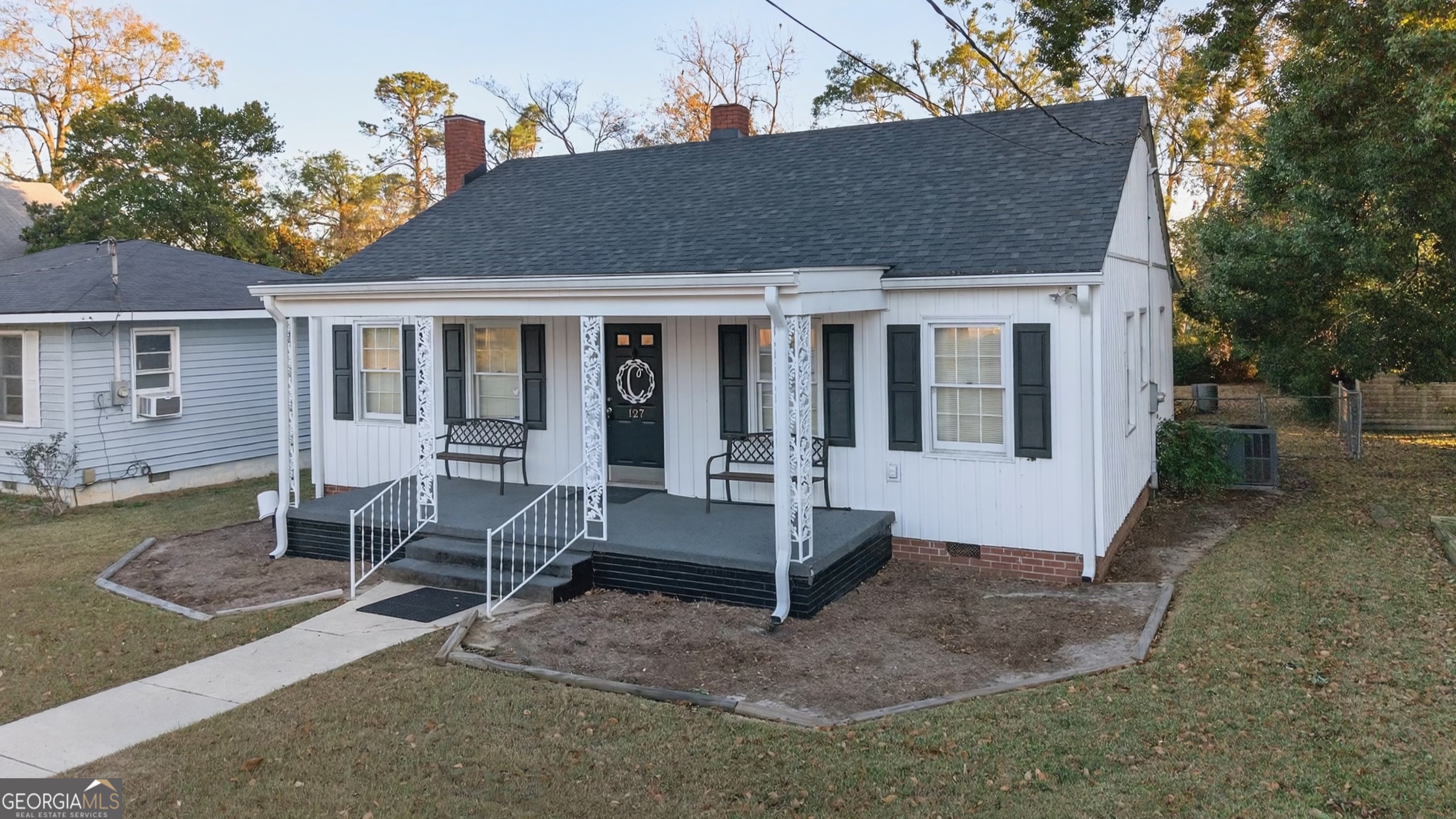 127 West Stuart Avenue Lyons, GA 30436 - Photo 3 of 71 a view of a house with backyard porch and sitting area