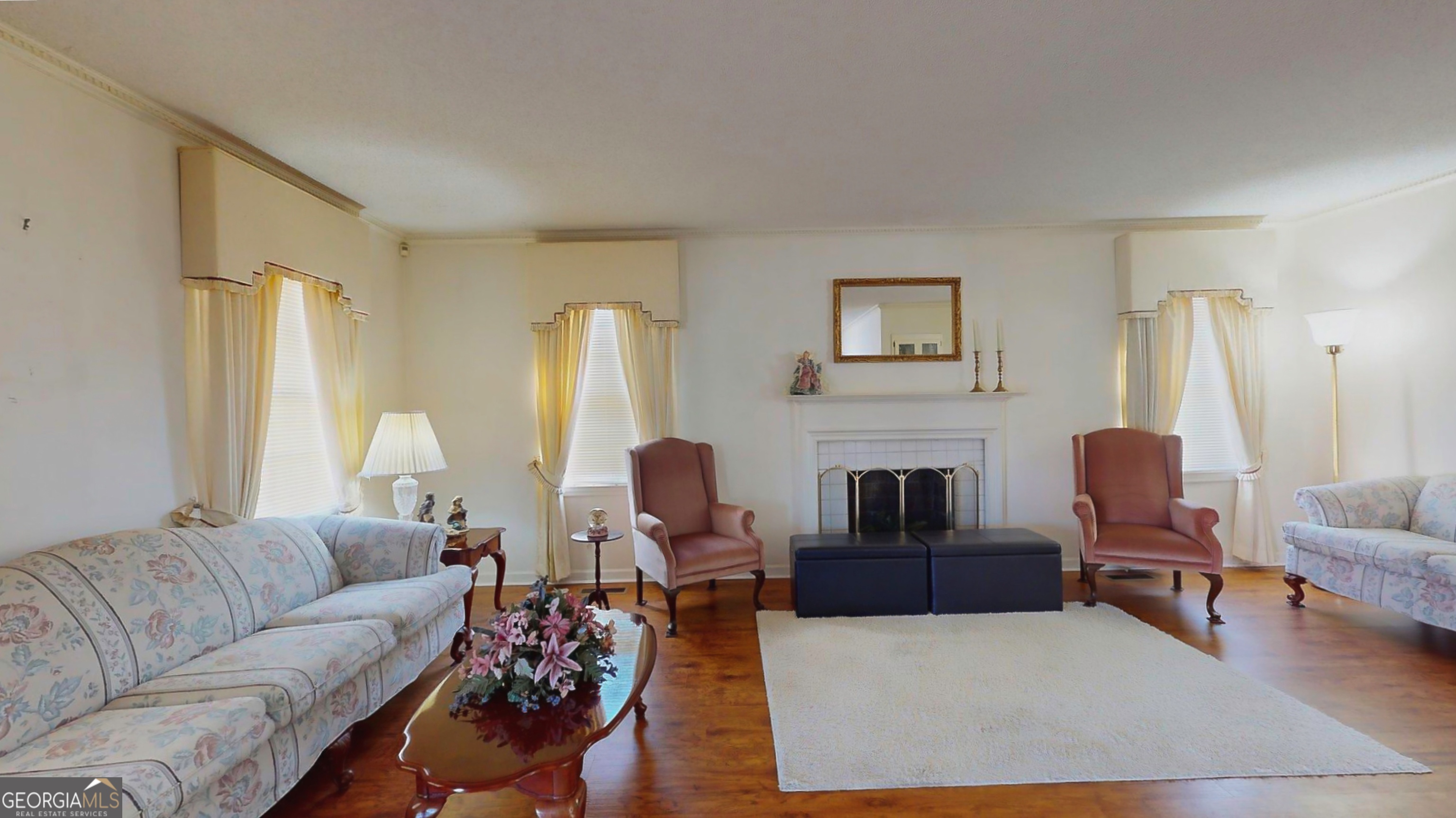 127 West Stuart Avenue Lyons, GA 30436 - Photo 41 of 71 a living room with furniture and a fireplace