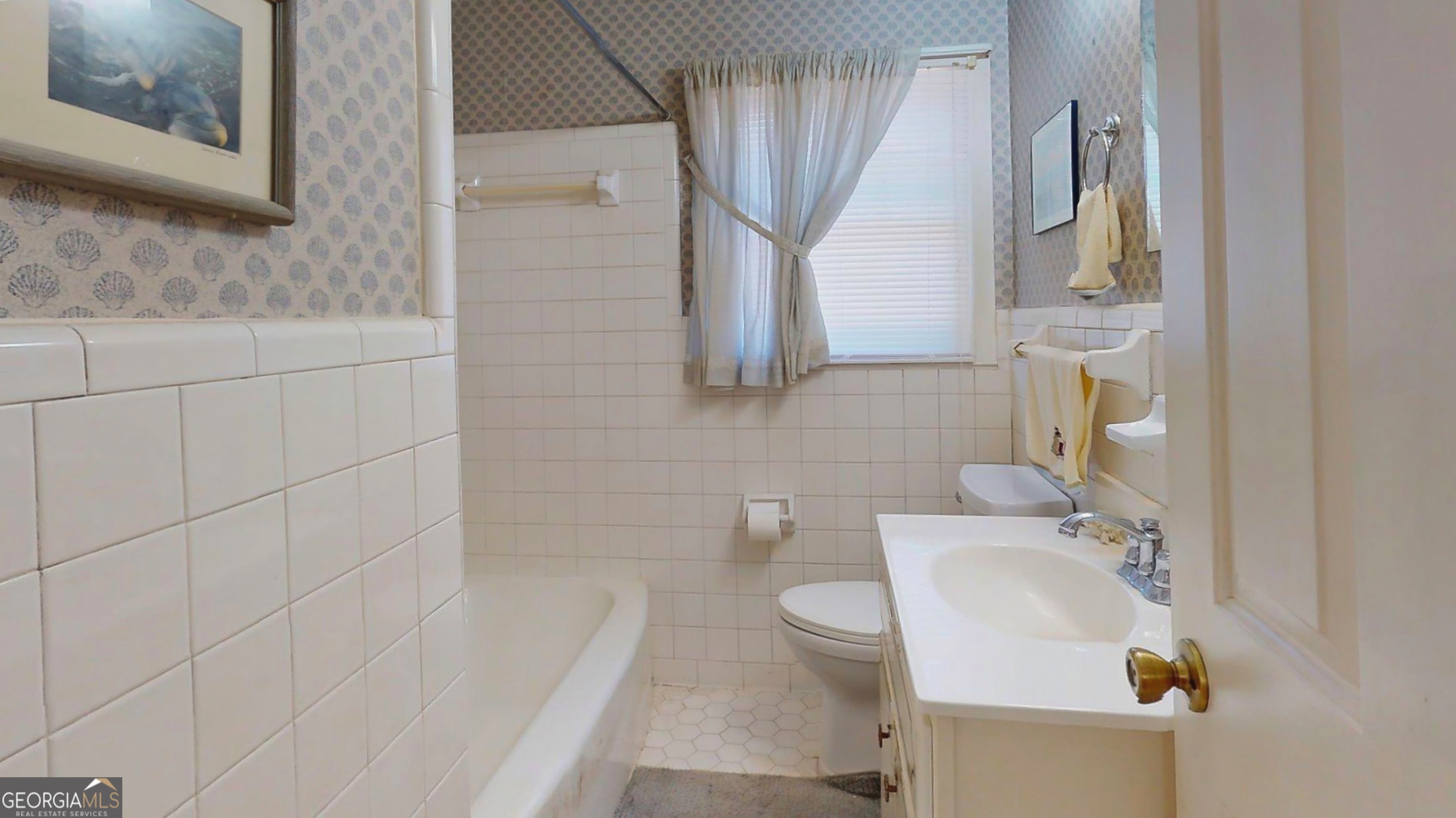 127 West Stuart Avenue Lyons, GA 30436 - Photo 48 of 71 a bathroom with a sink a toilet and mirror