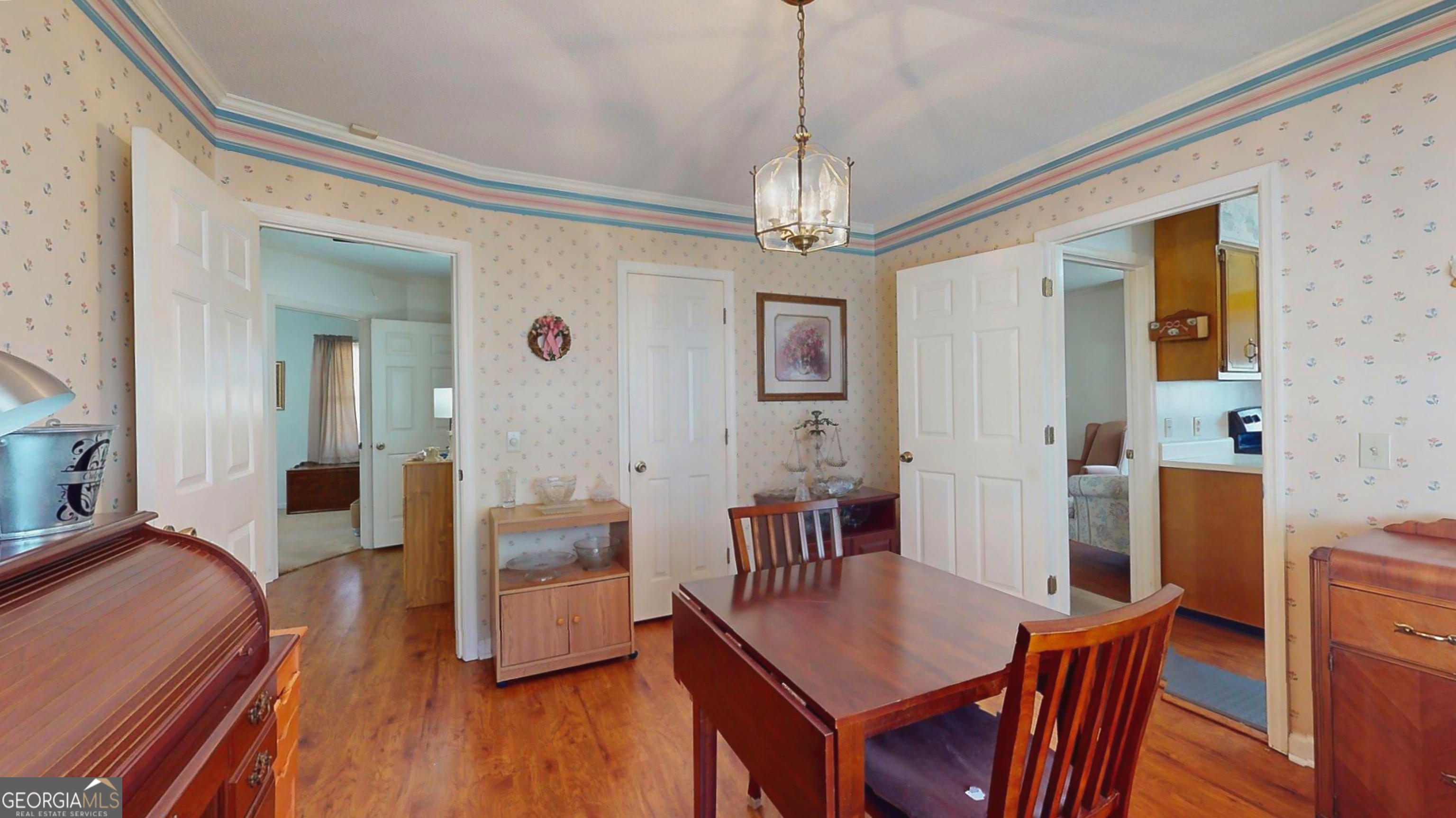 127 West Stuart Avenue Lyons, GA 30436 - Photo 56 of 71 a view of a dining room with furniture and wooden floor