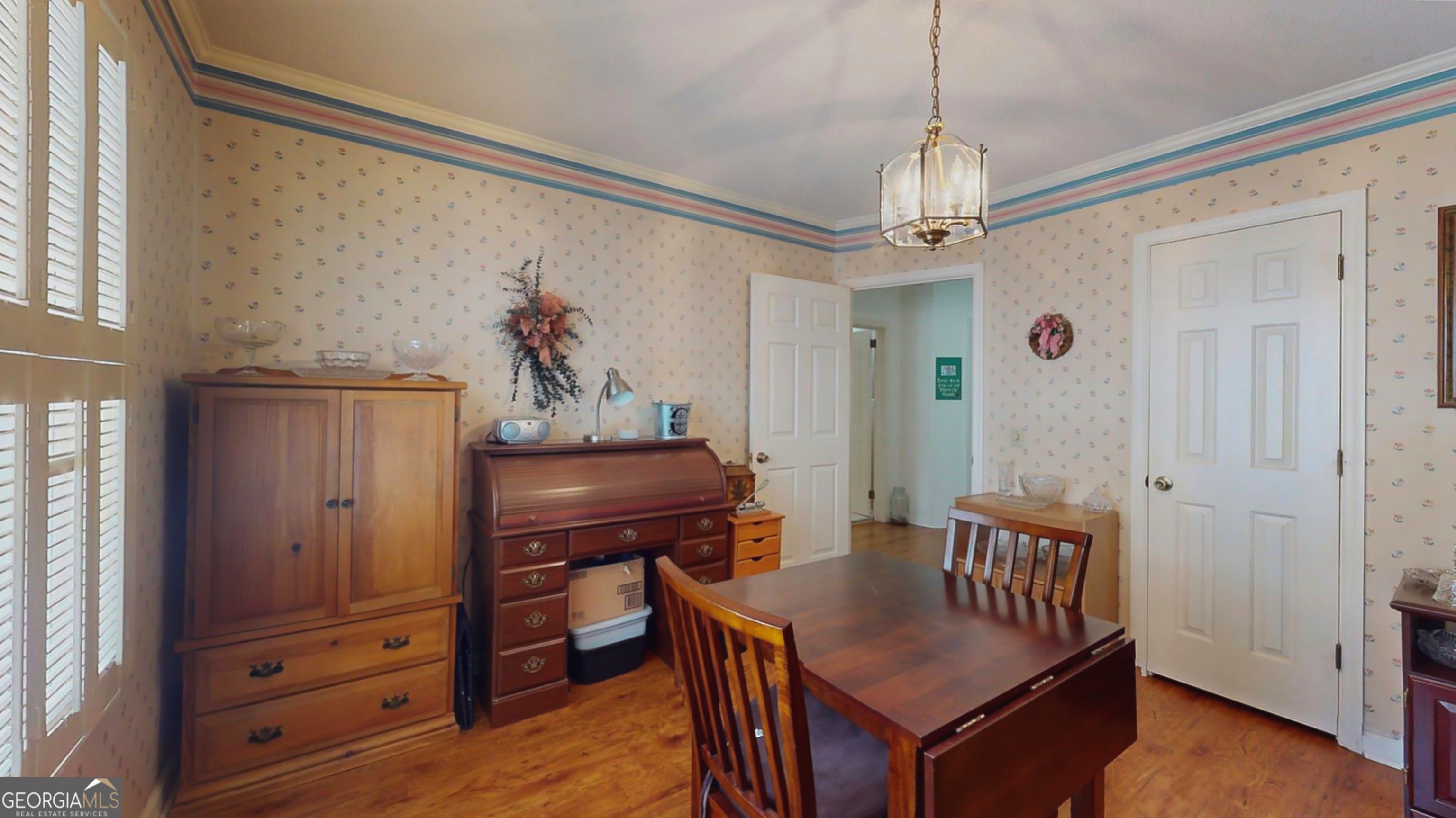 127 West Stuart Avenue Lyons, GA 30436 - Photo 57 of 71 a view of a dining room with furniture window and wooden floor