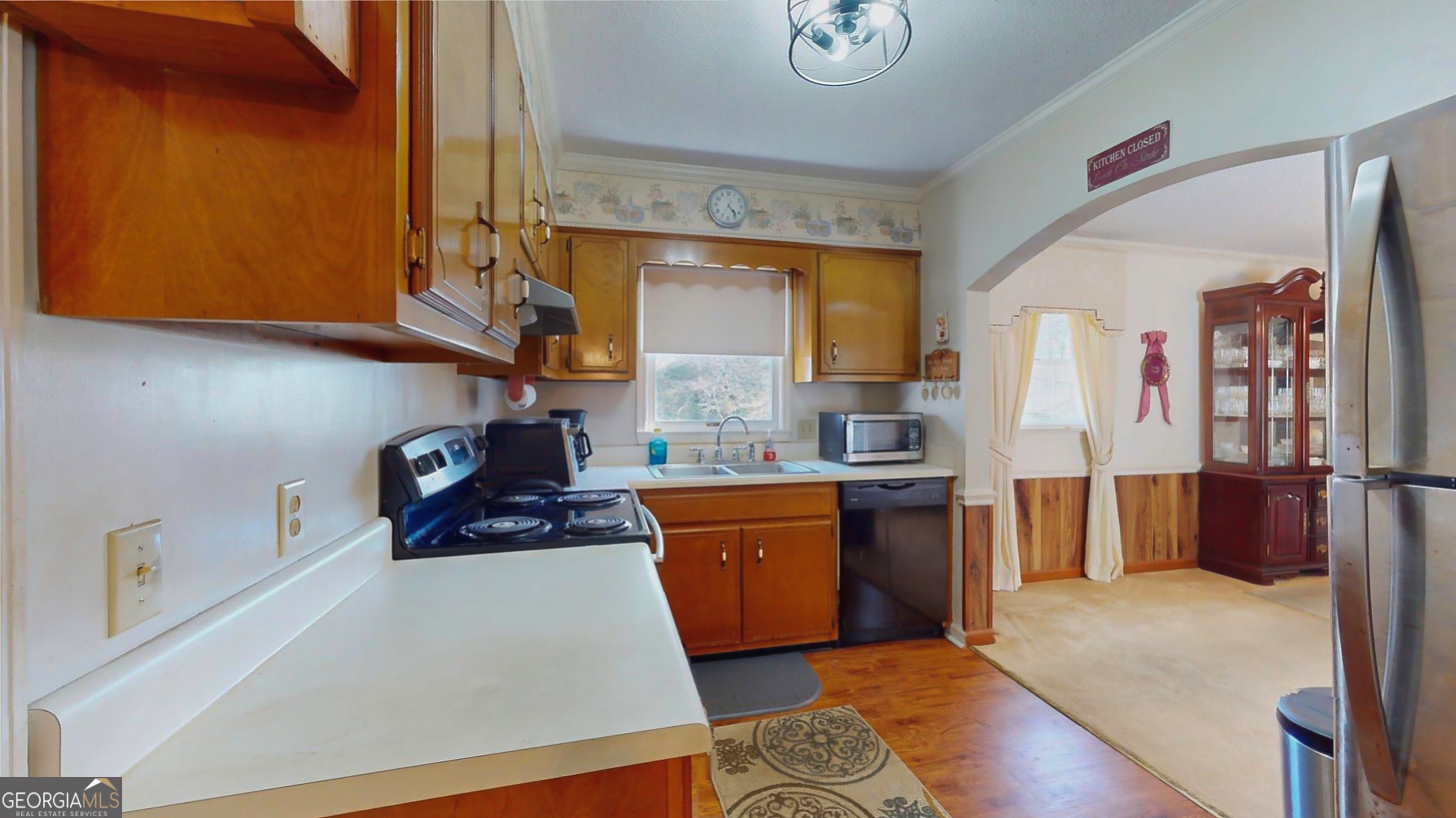 127 West Stuart Avenue Lyons, GA 30436 - Photo 58 of 71 a kitchen with stainless steel appliances granite countertop a stove a sink and a refrigerator