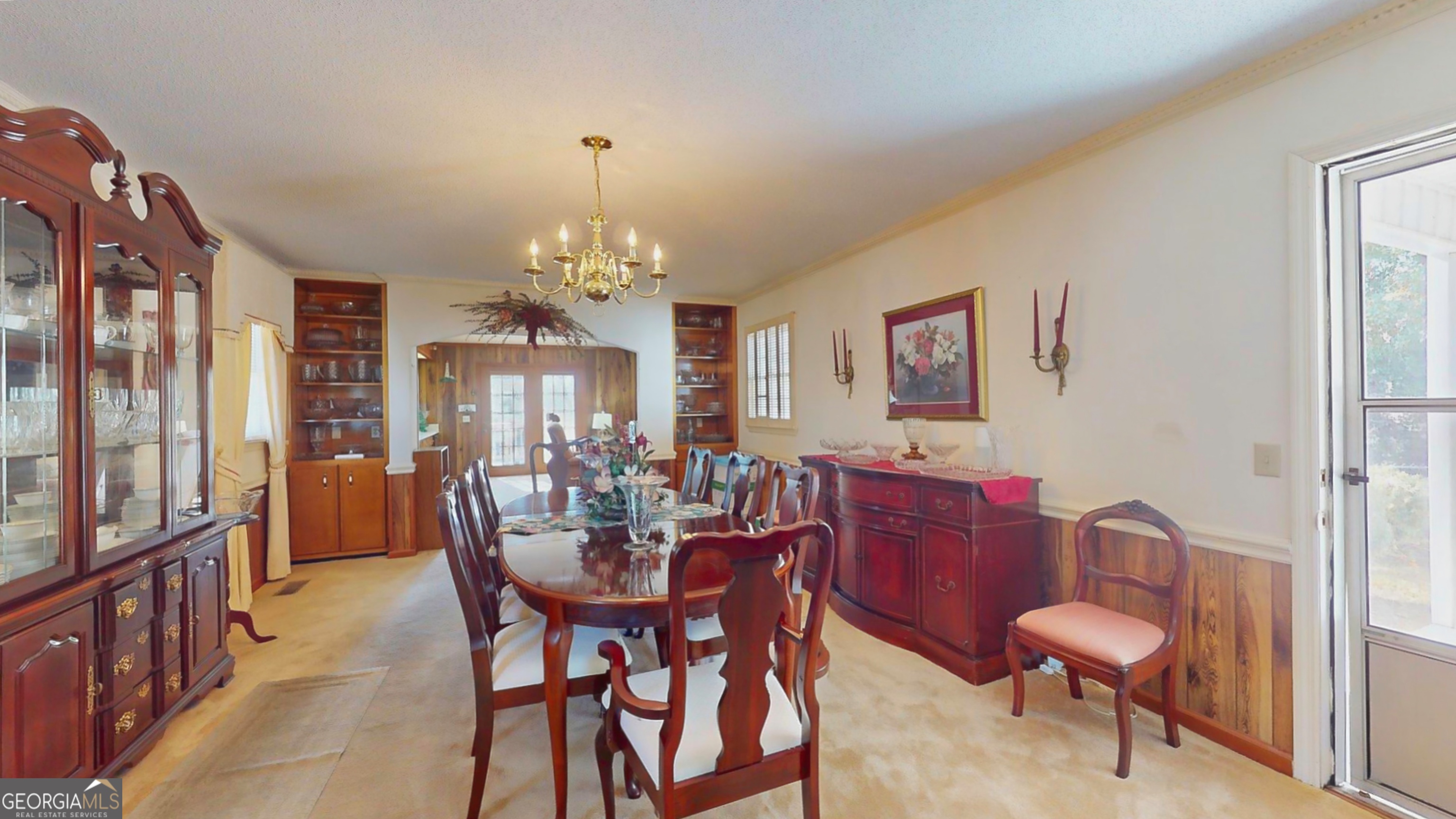 127 West Stuart Avenue Lyons, GA 30436 - Photo 62 of 71 a view of a dining room with furniture and chandelier