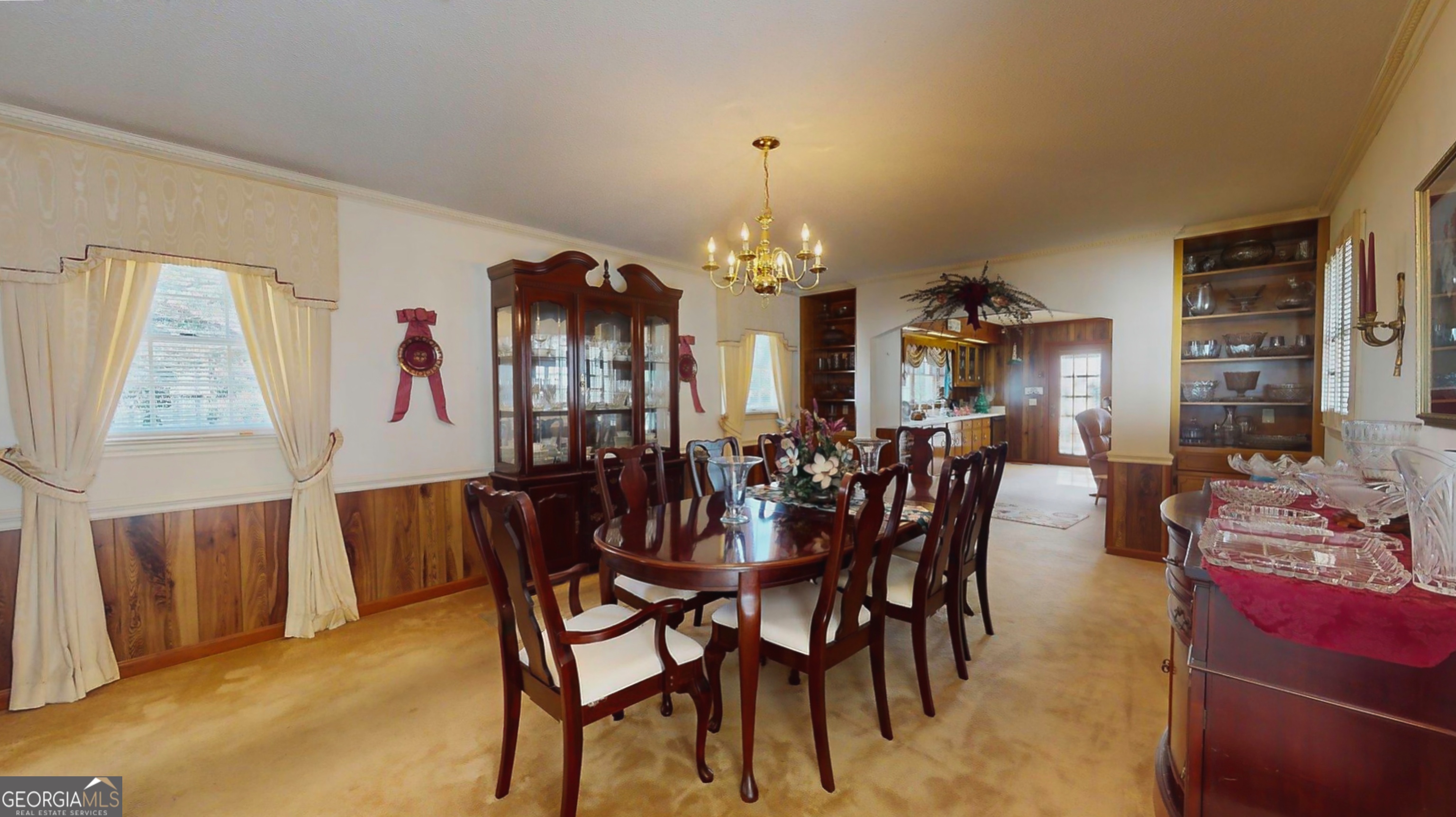 127 West Stuart Avenue Lyons, GA 30436 - Photo 63 of 71 a view of a dining room with furniture and chandelier