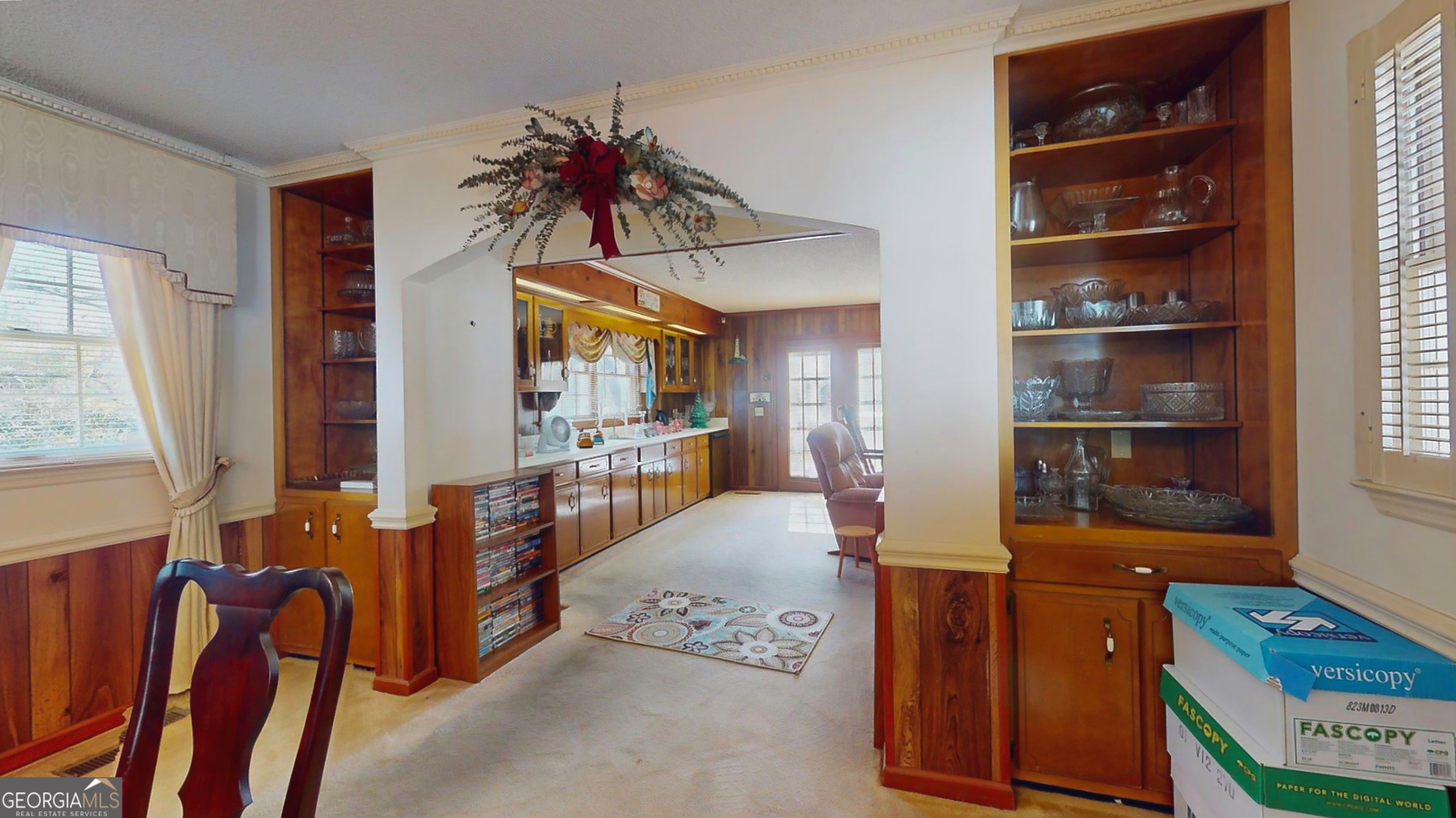 127 West Stuart Avenue Lyons, GA 30436 - Photo 64 of 71 a living room with furniture and a book shelf