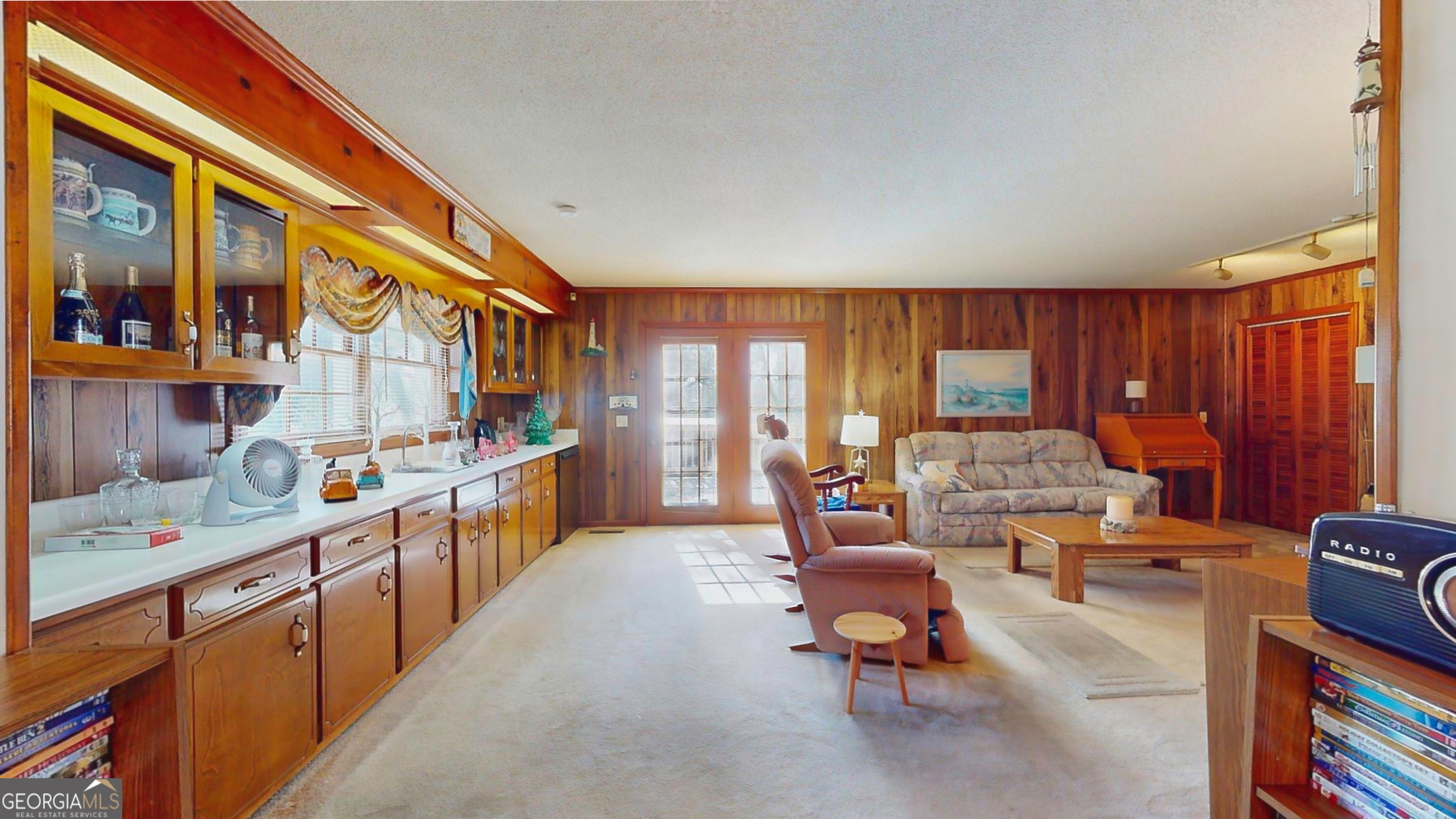 127 West Stuart Avenue Lyons, GA 30436 - Photo 66 of 71 a living room with furniture a flat screen tv and a large window