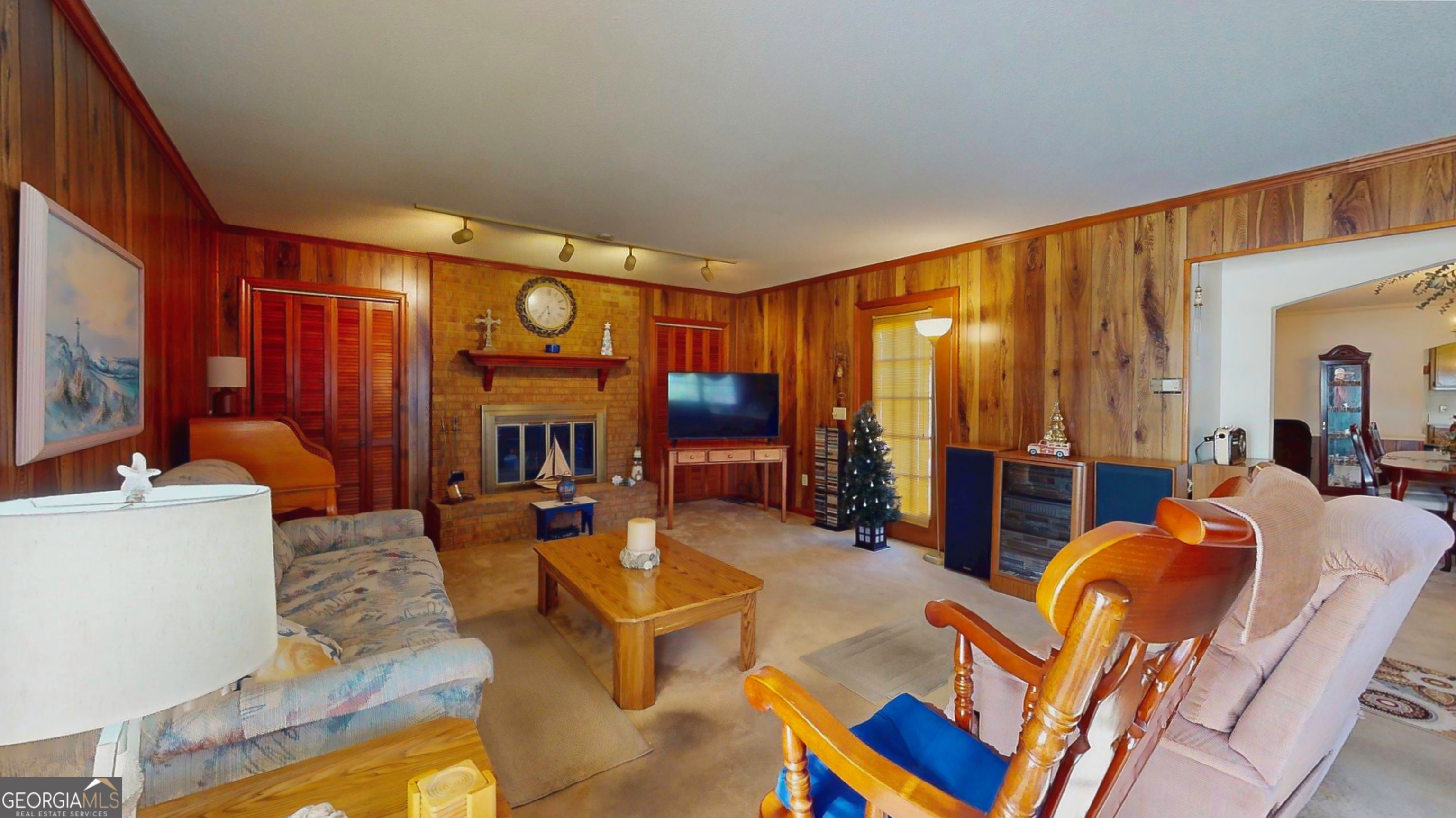 127 West Stuart Avenue Lyons, GA 30436 - Photo 67 of 71 a living room with fireplace furniture and a large window