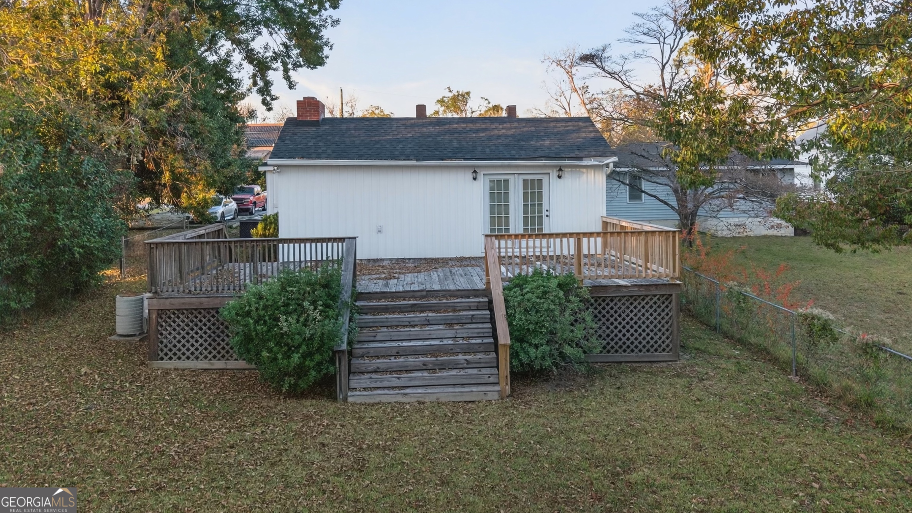127 West Stuart Avenue Lyons, GA 30436 - Photo 7 of 71 a view of a house with a yard and plants