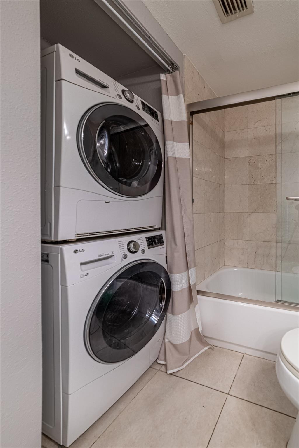 103 Capri B, Unit 103 Delray Beach, FL 33484 - Photo 19 of 24 a utility room with dryer and washer