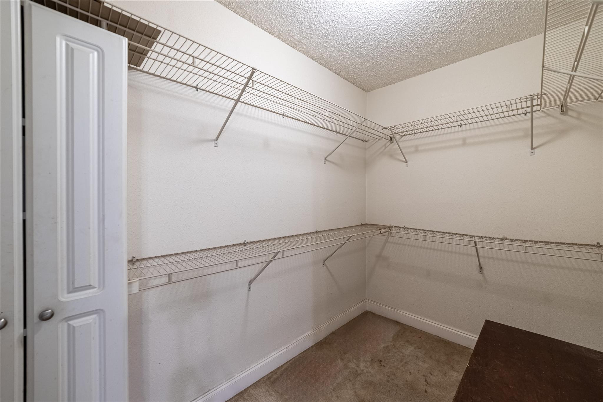 103 Capri B, Unit 103 Delray Beach, FL 33484 - Photo 24 of 24 a view of a room with racks on the wall