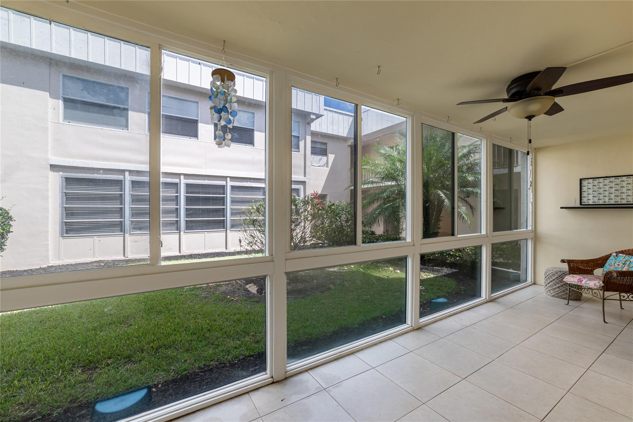 103 Capri B, Unit 103 Delray Beach, FL 33484 - Photo 5 of 24 a house view with a backyard space