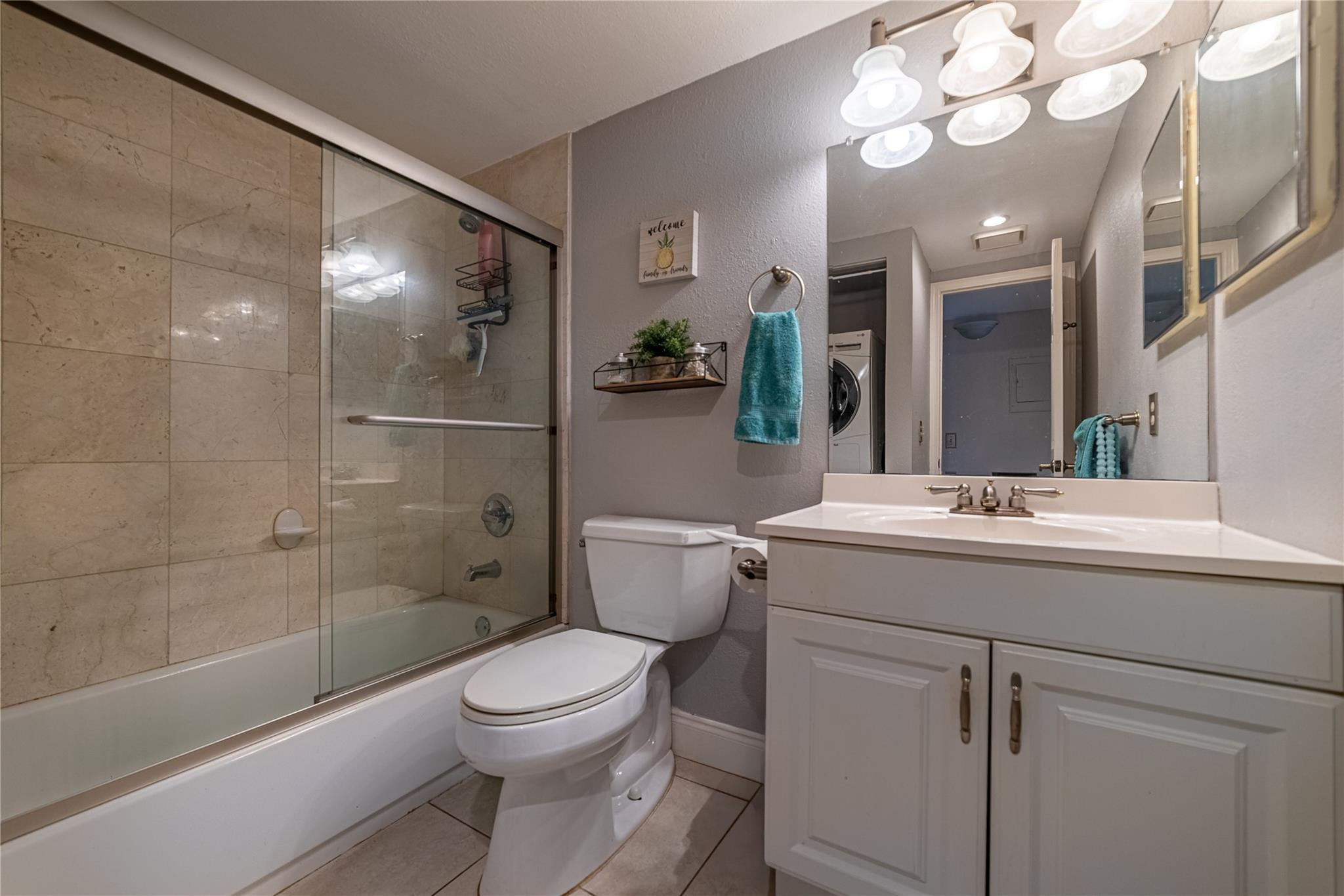 103 Capri B, Unit 103 Delray Beach, FL 33484 - Photo 9 of 24 a bathroom with a sink a toilet and shower