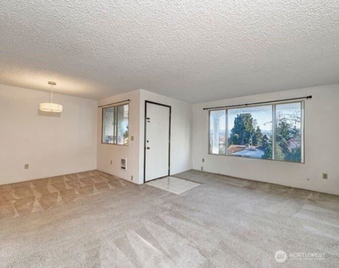 3718 Rockefeller Avenue, Unit A D Everett, WA 98201 - Photo 3 of 8 a view of an empty room with a window